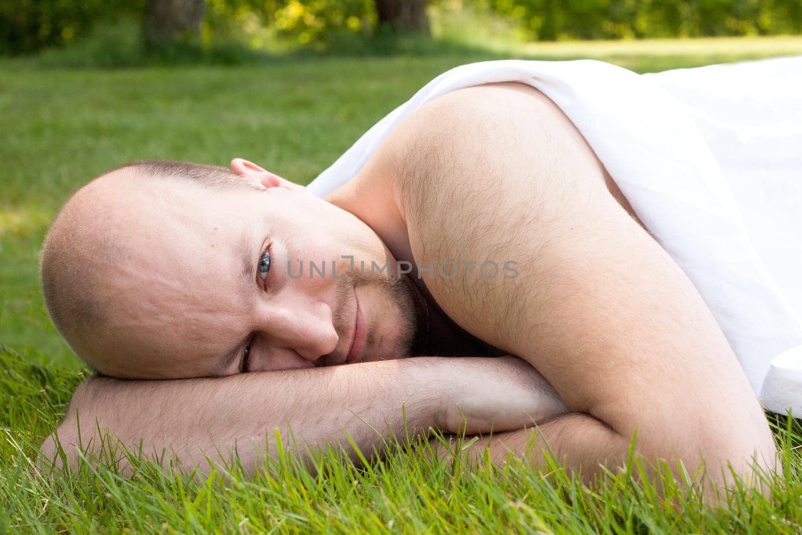 Happy young couple dressed white in the nature