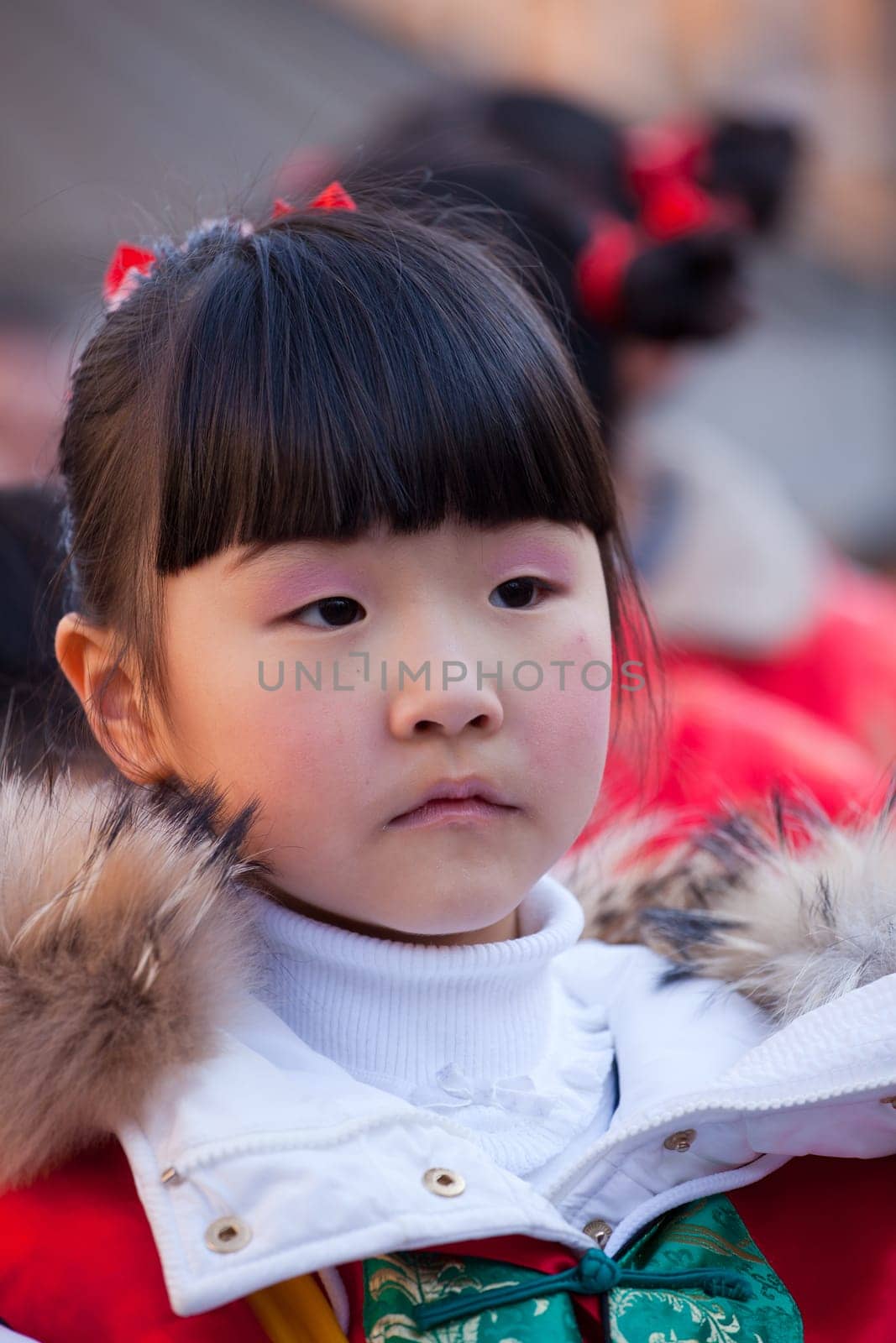 MILAN, ITALY - FEBRUARY 10, 2013: Child during Chinese New Year parade in Milan