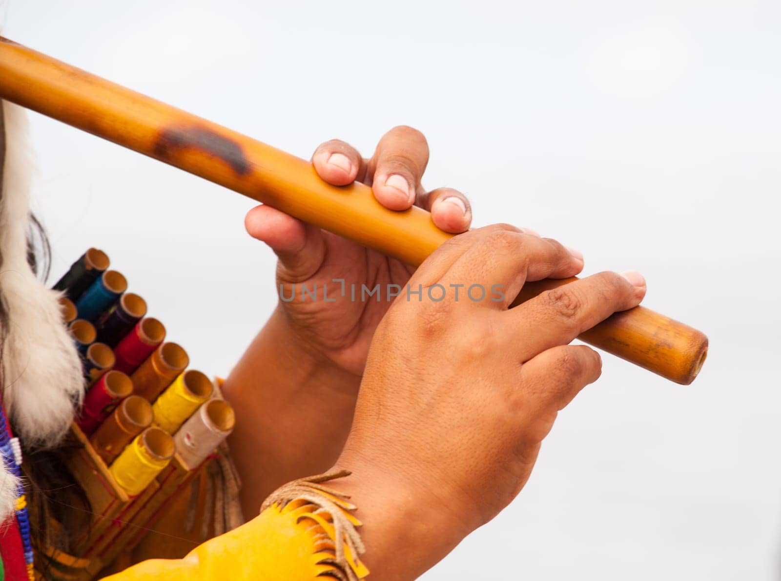 Peruvian Man In Native Costume Playing flute