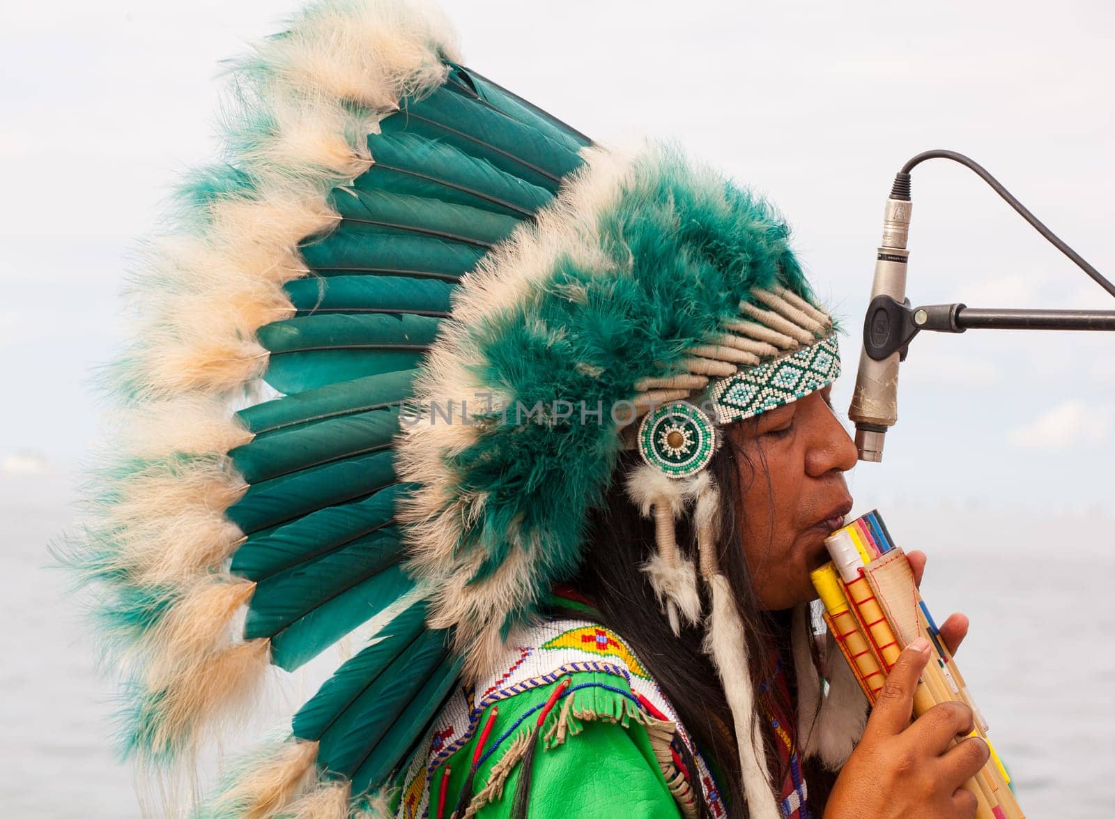 TRIESTE, ITALY - 14 DECEMBER 2012:Native american playing flute