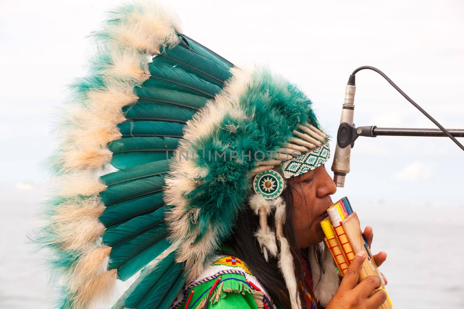 TRIESTE, ITALY - 14 DECEMBER 2012:Native american playing flute