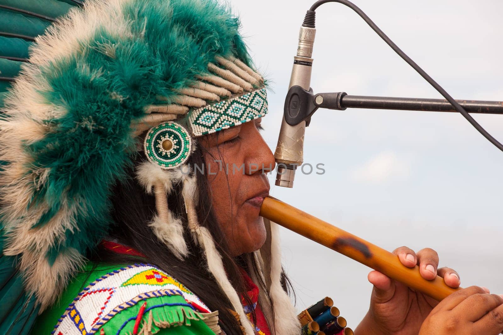 TRIESTE, ITALY - 14 DECEMBER 2012:Native american playing flute