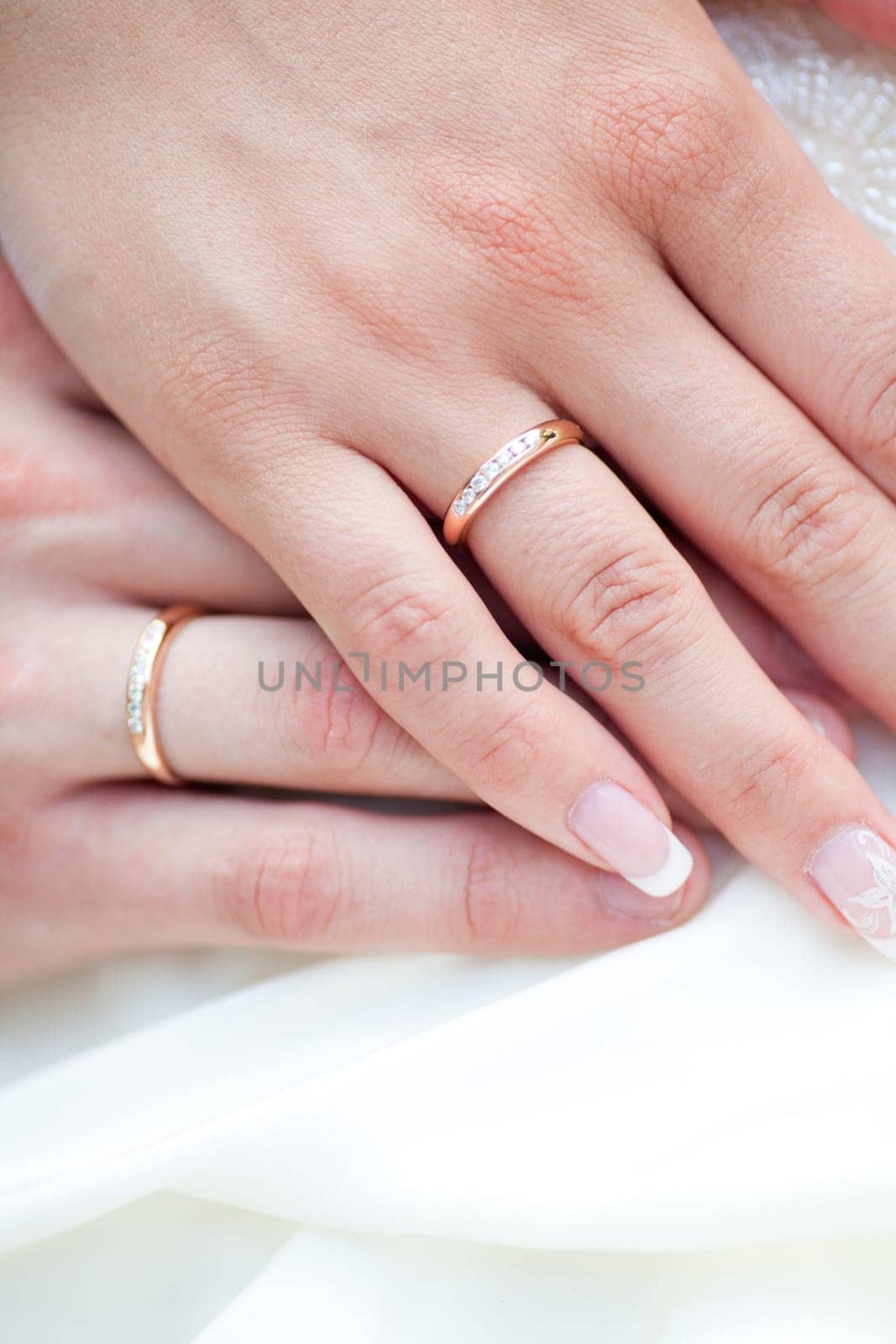 The bride and groom's hands together