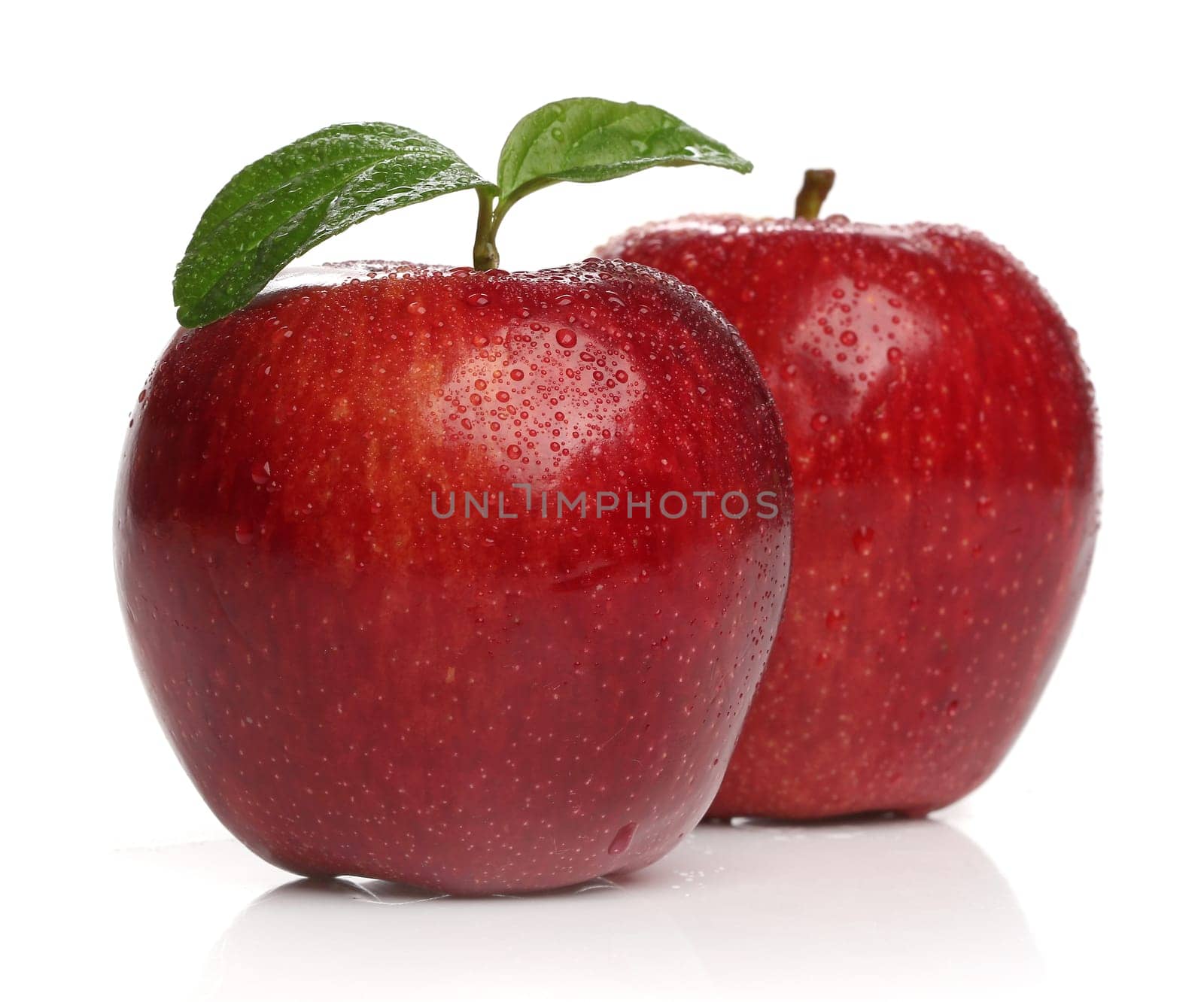 Delicious healthy red apples over white background