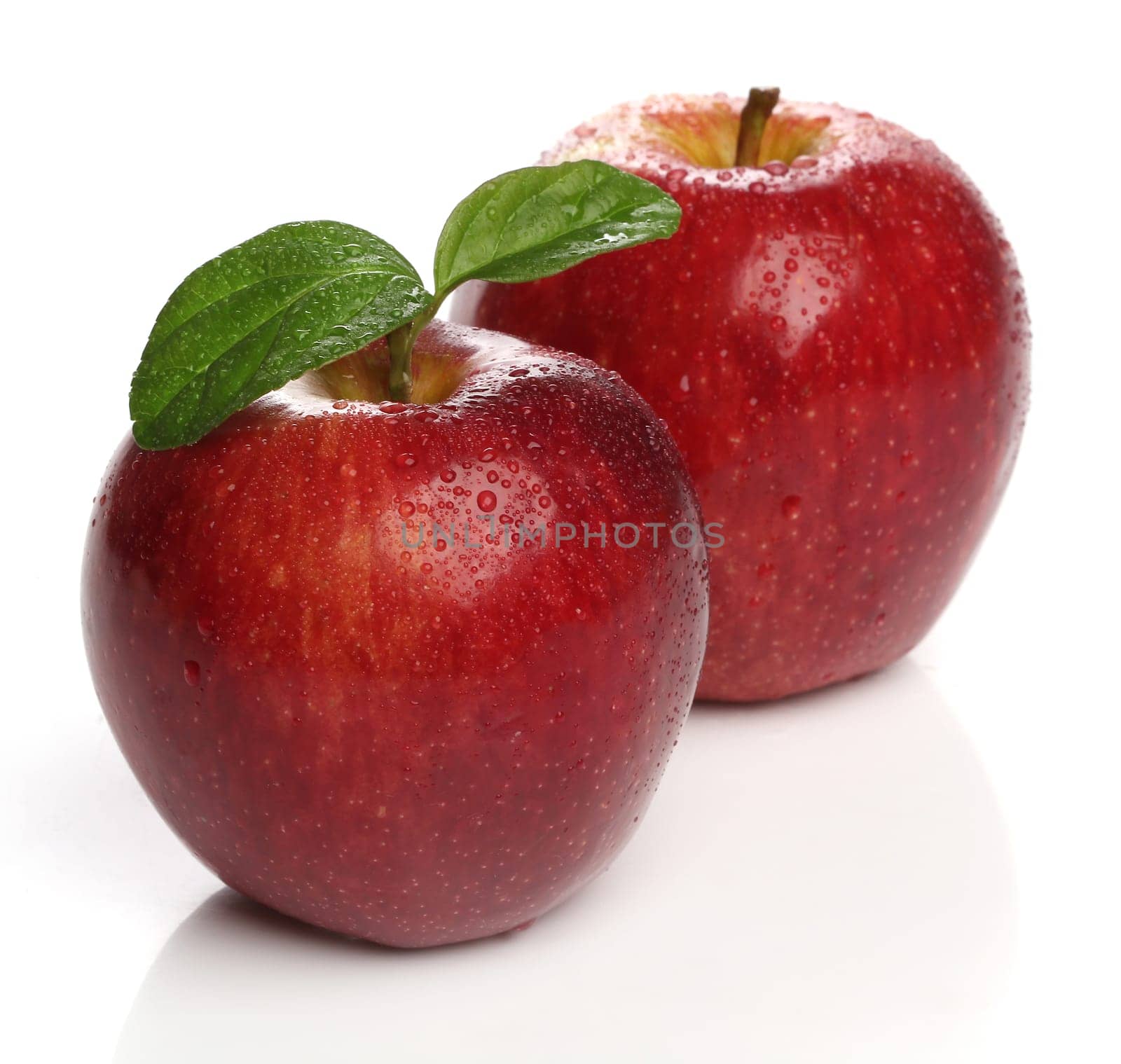 Delicious healthy red apples over white background