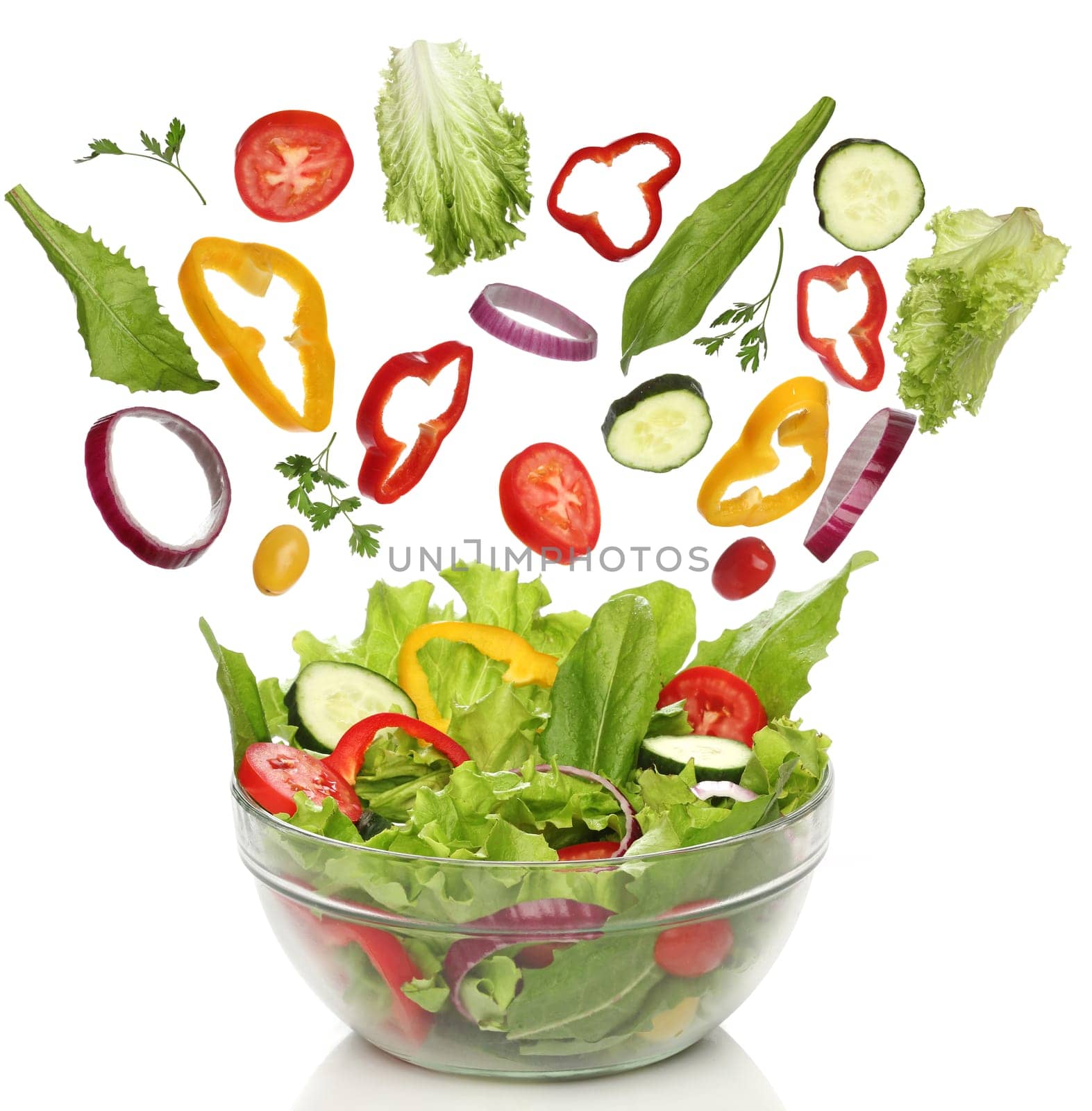 Falling fresh vegetables. Healthy salad isolated