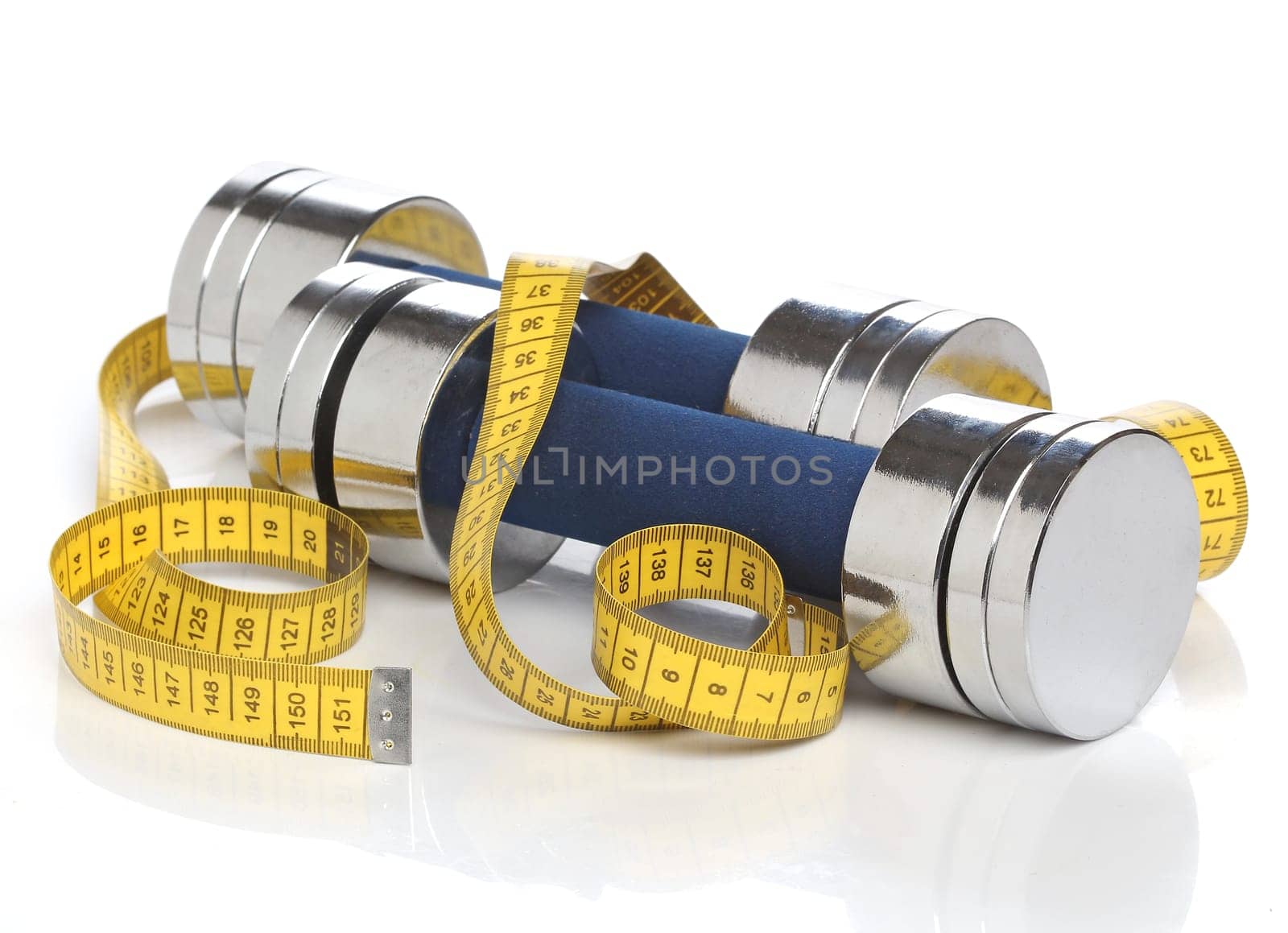 Dumbbells and a measuring tape over white