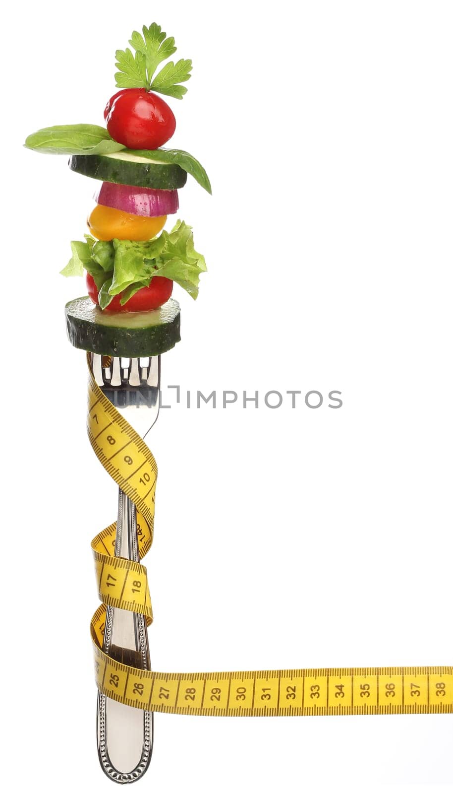 Mixed vegetables on a fork isolated. Diet concept