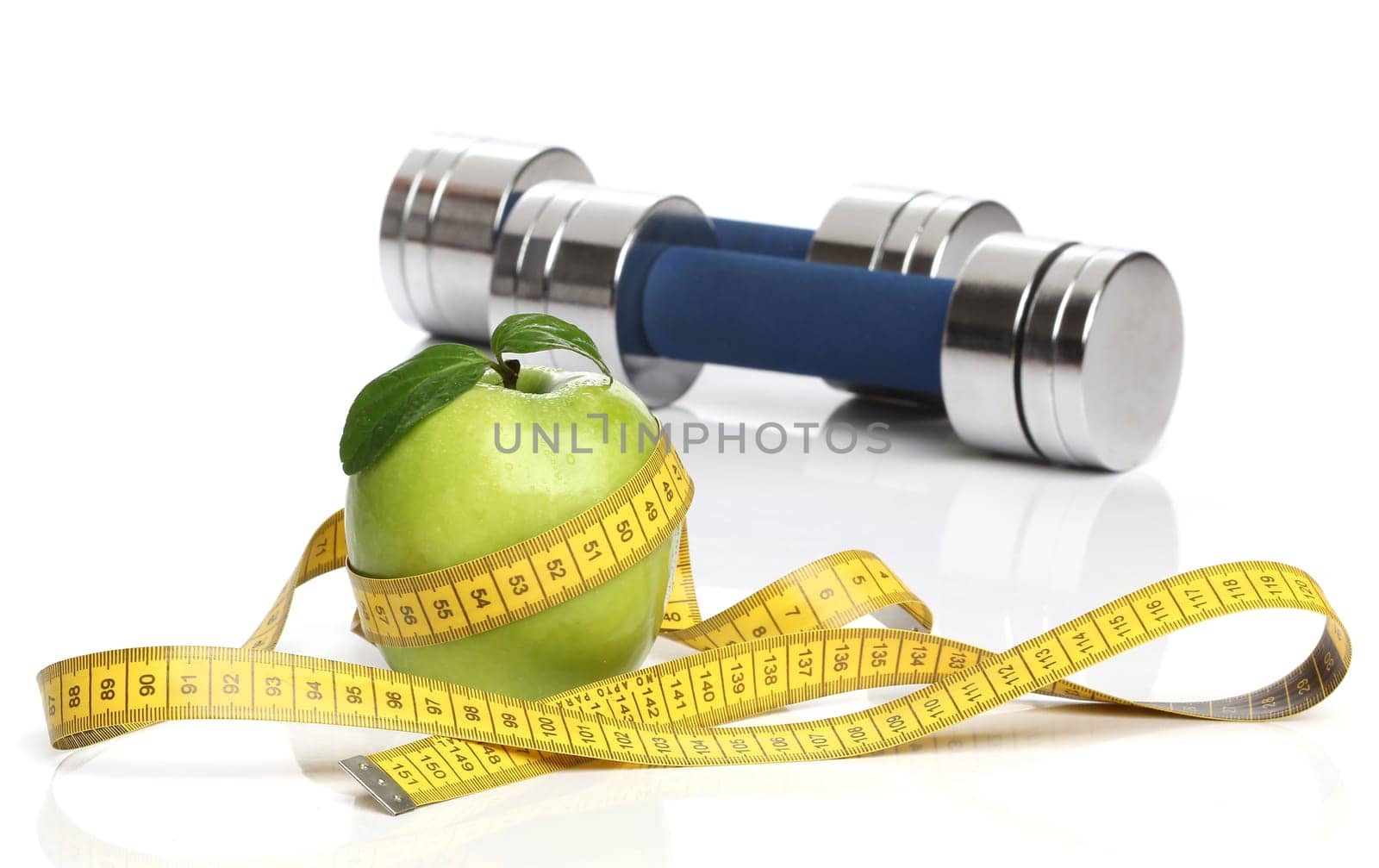 Healthy green apple and a measuring tape isolated