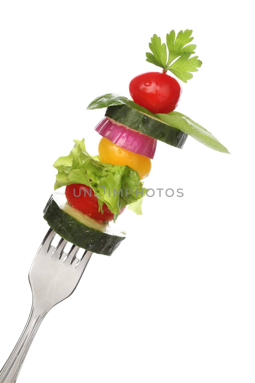 Mixed vegetables on a fork isolated. Diet concept