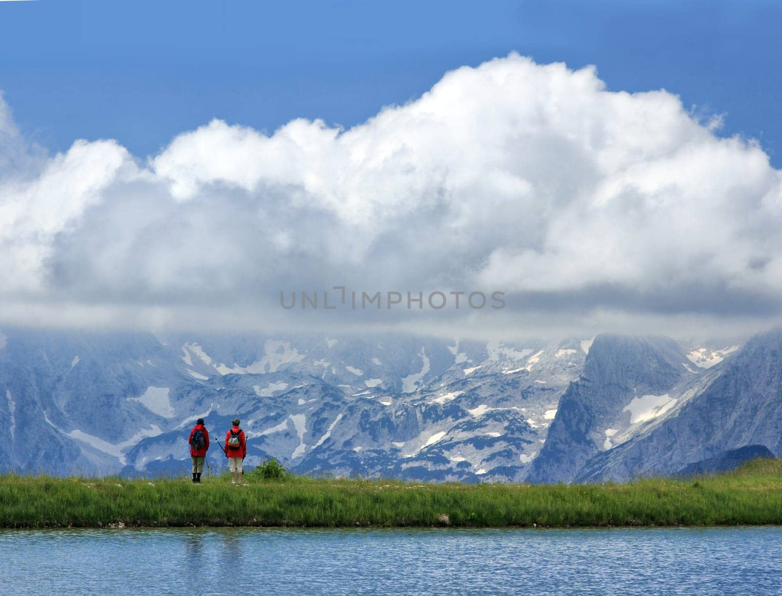 the tourists watching the panorama of the mountains