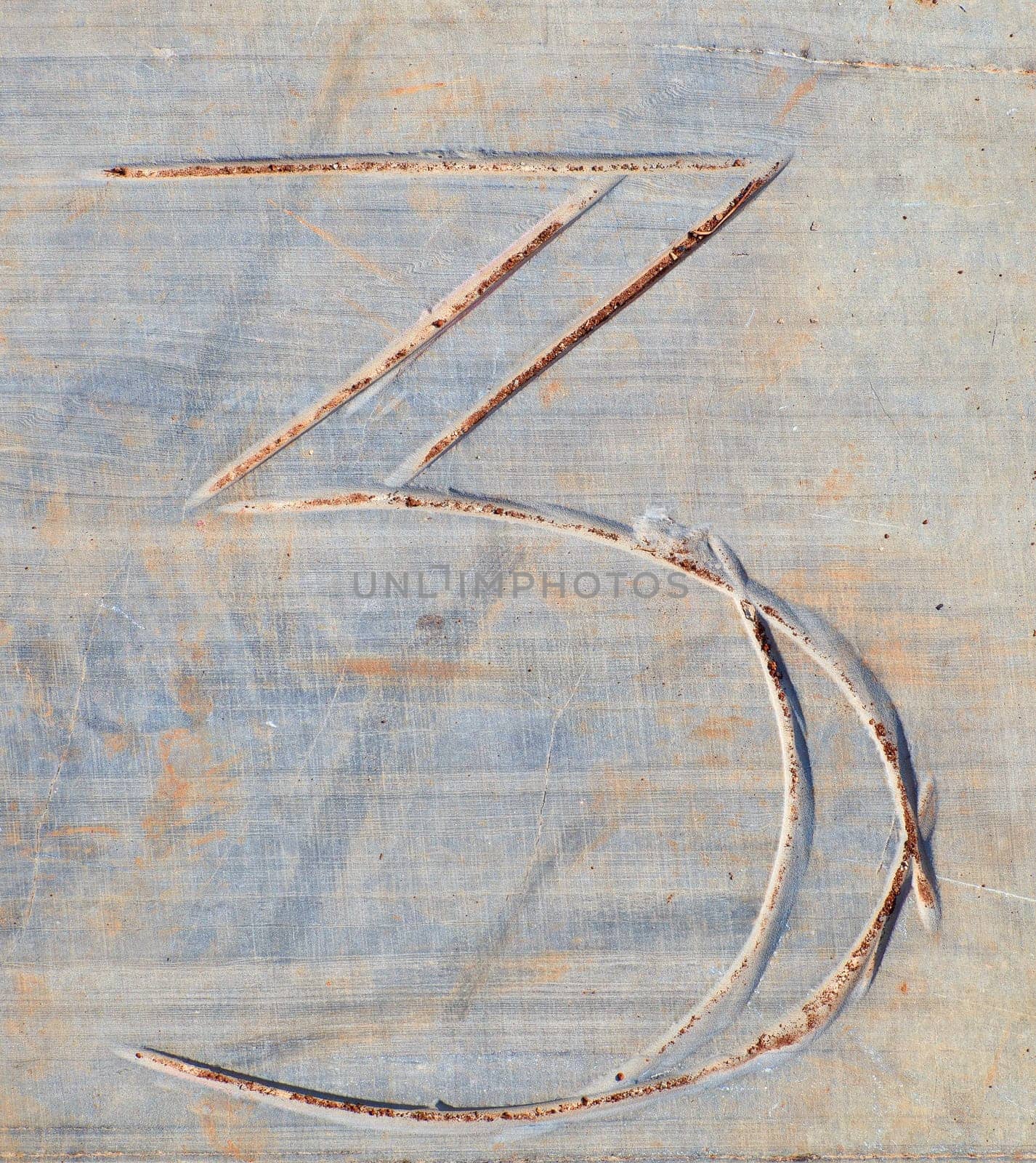 Photo of Numbers three etched in stone