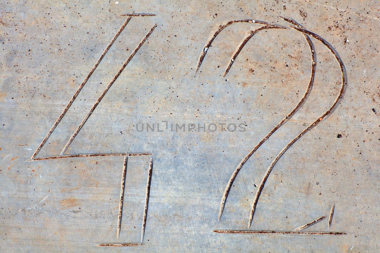 Photo of Numbers etched in stone