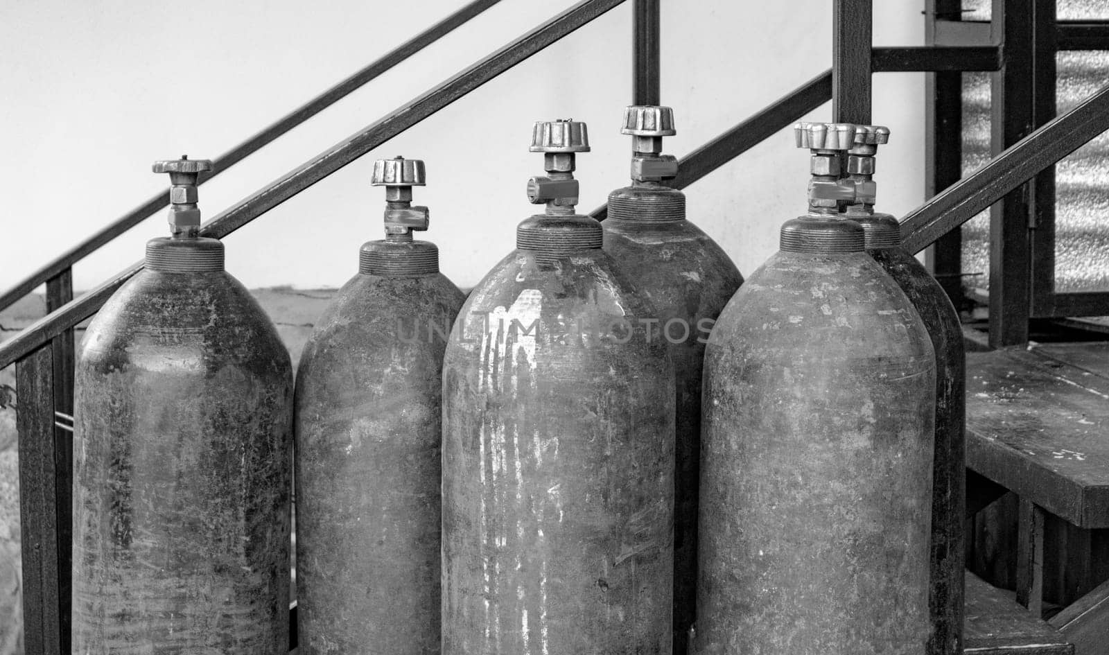 Close-up of steel cylinders with compressed gas - argon, carbon dioxide or oxygen for welding, outdoors.