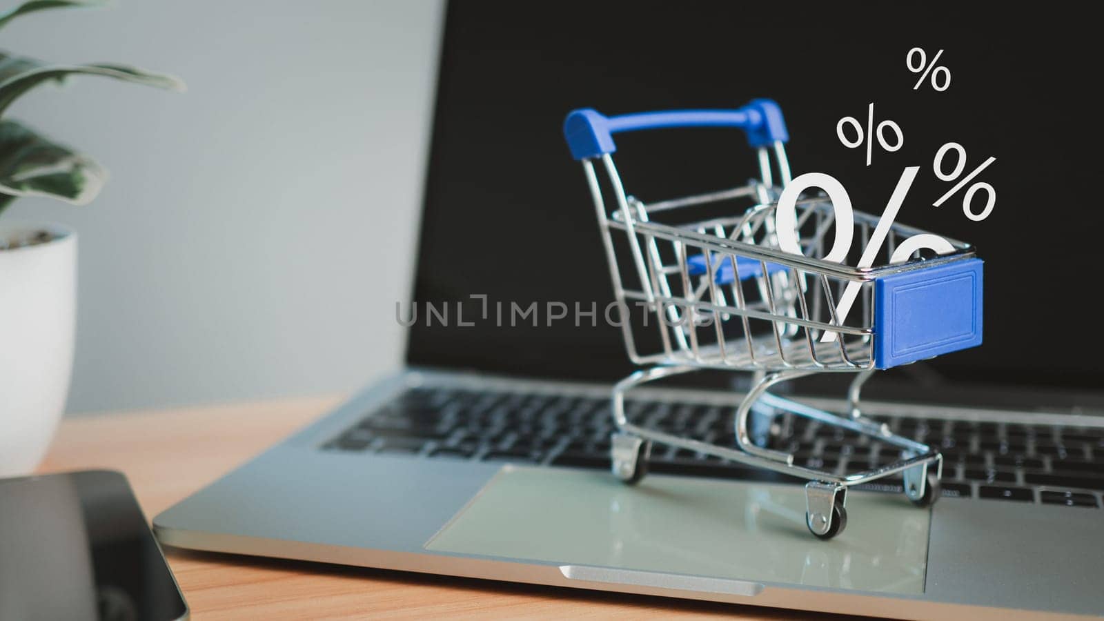 Sale percentage falling in shopping cart located on a computer keyboard, Online shopping concept Special price product, Specials and promotions by Unimages2527