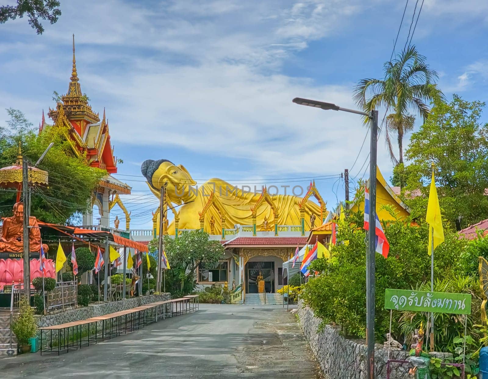 Golden Buddha statue at Wat Sri Sunthon temple, Phuket, Thailand by Elenaphotos21