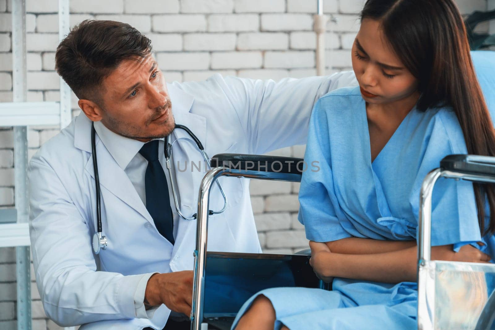 Doctor in professional uniform examining patient at hospital or medical clinic. Health care , medical and doctor staff service concept. Jivy