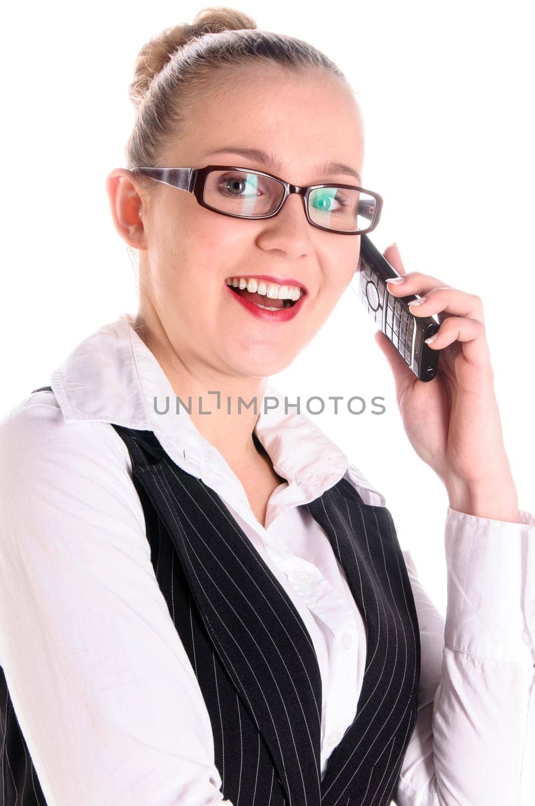 Young businesswoman with blond hair in a business suit (tax consultant,manager,secretary) smiles on the phone (mobile phone) in front of a white background