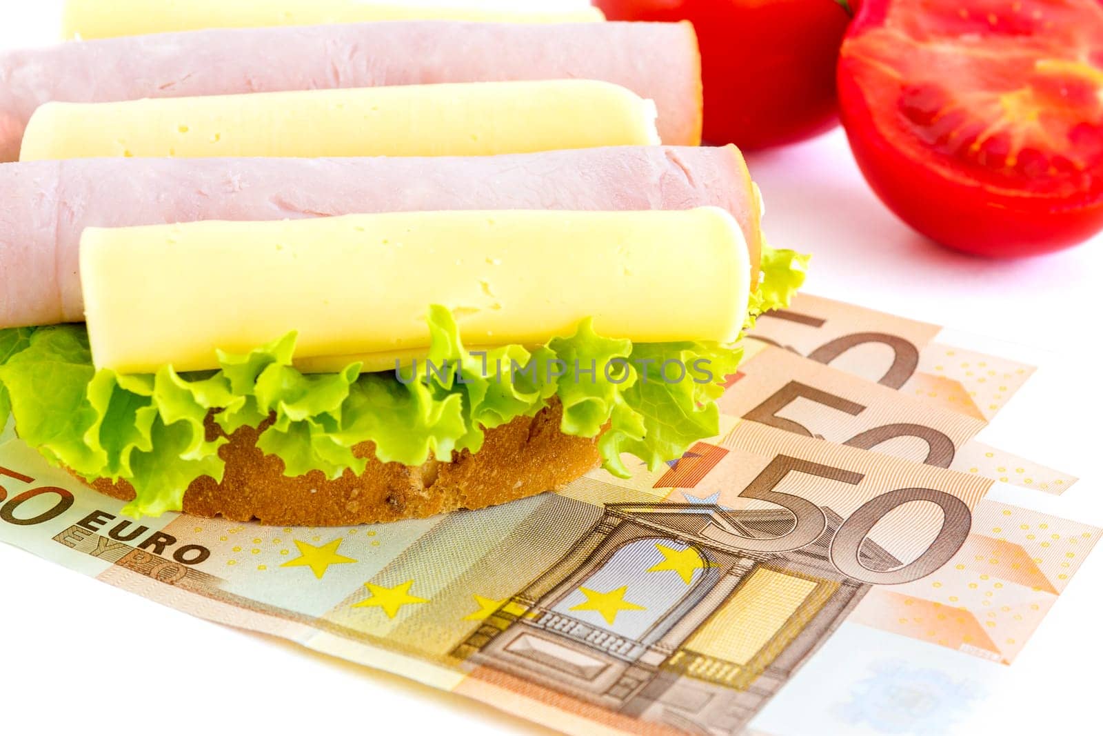 Sandwich and money which represents the hunger for money