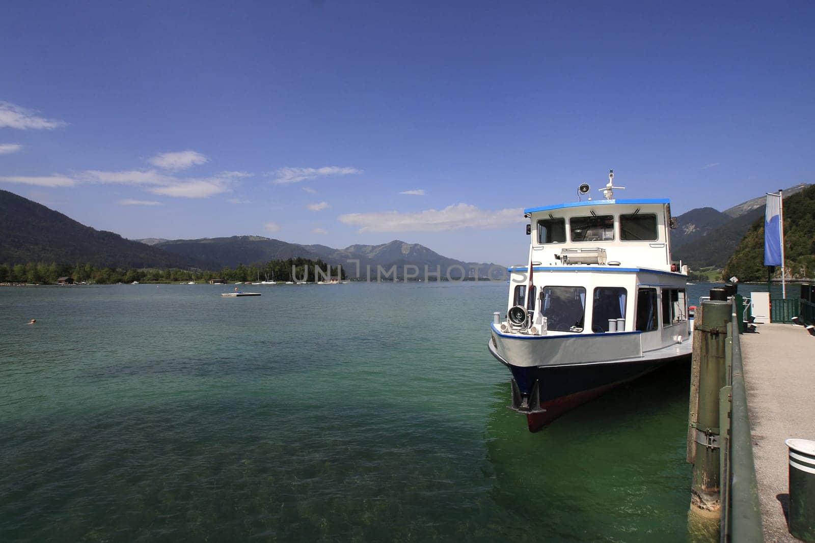 Austria : panorama of the lake,boat and mountains