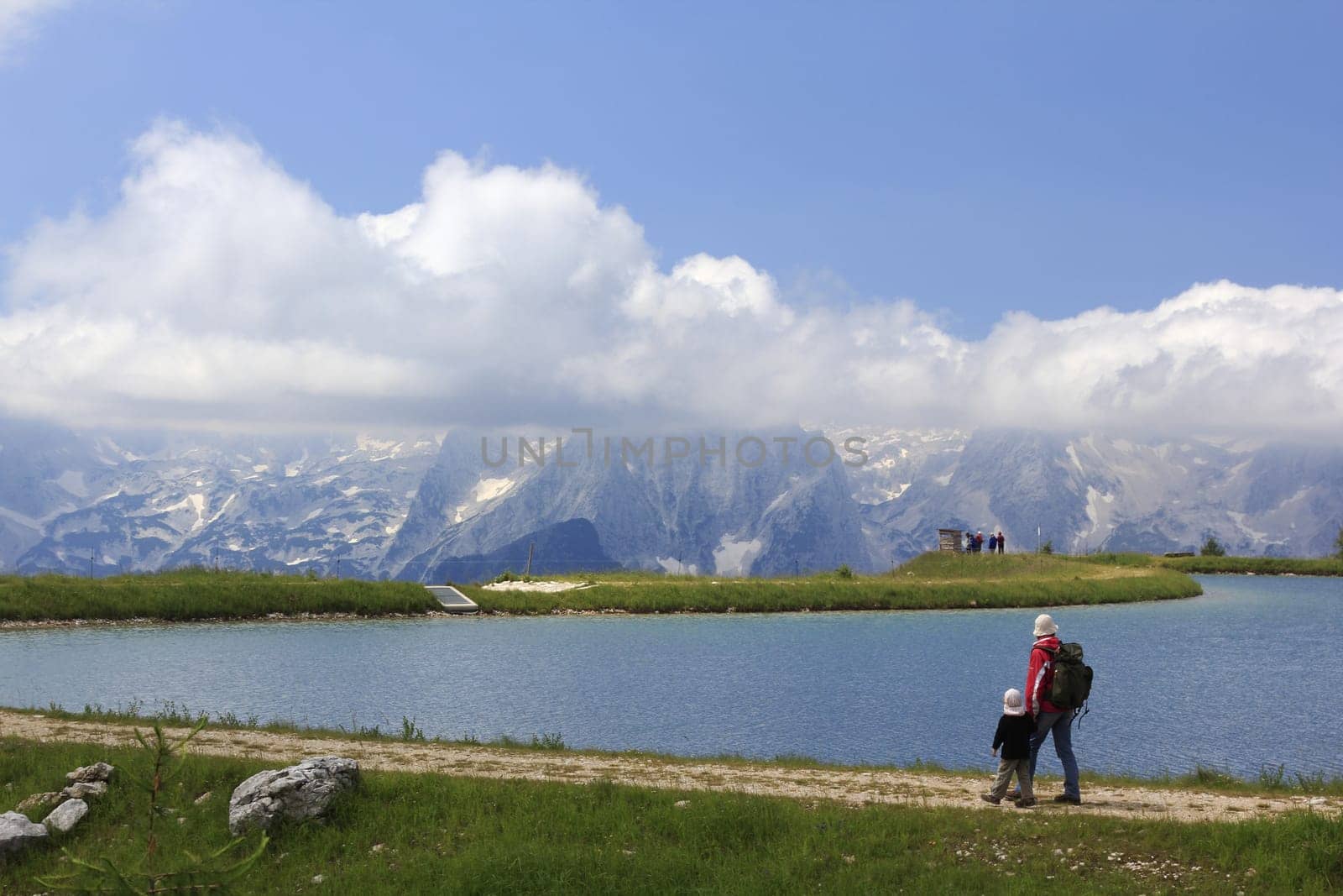 austria the tourists watching the amazing panorama of the mountains