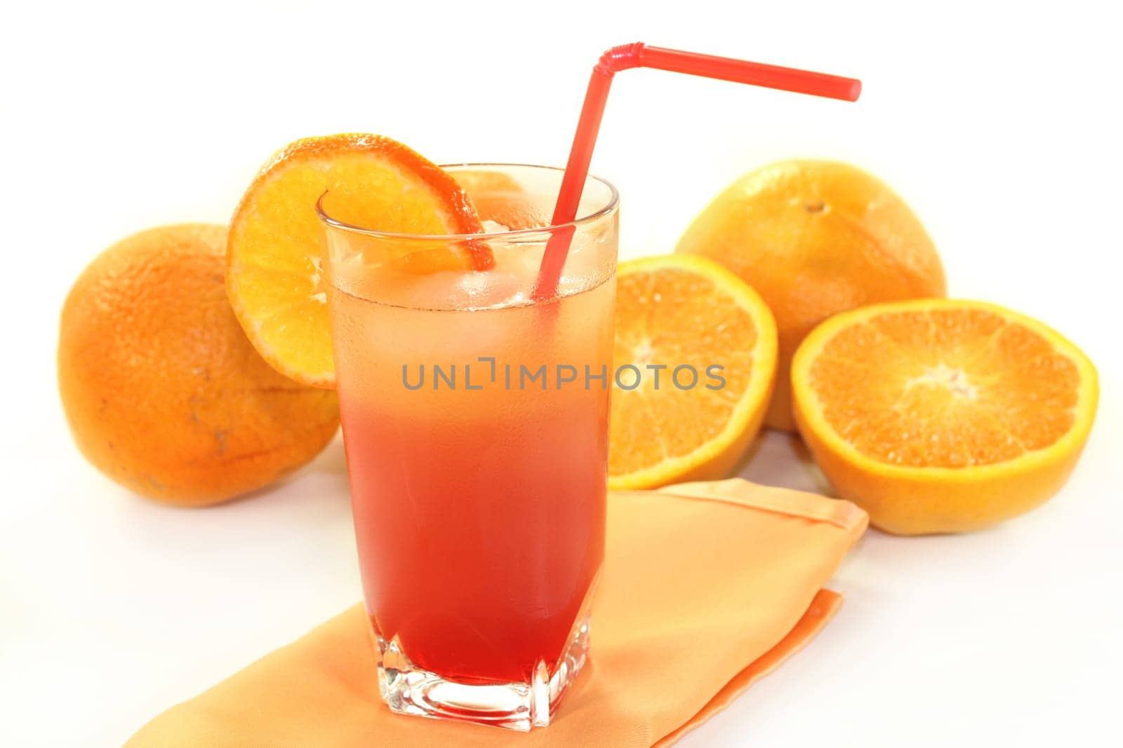 a glass of Campari orange and ice cubes
