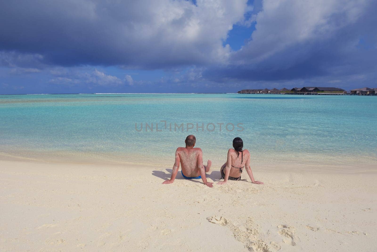 happy young  couple at summer vacation have fun and relax at beautiful sunny  day on beach
