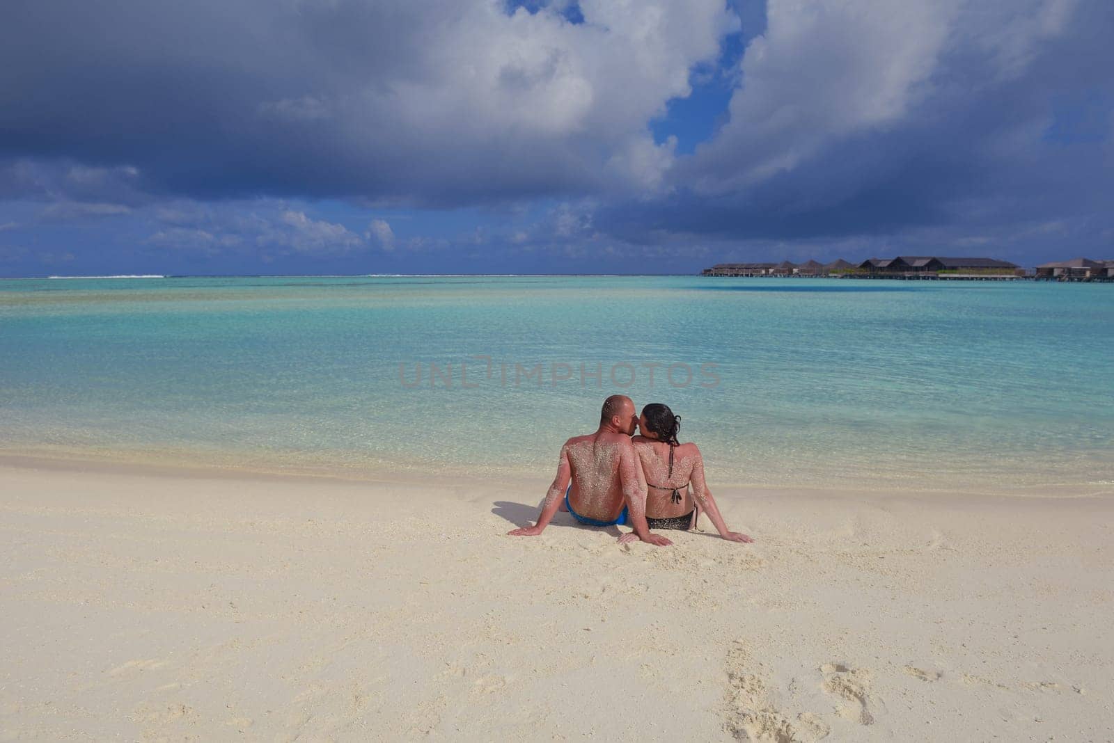 happy young  couple at summer vacation have fun and relax at beautiful sunny  day on beach