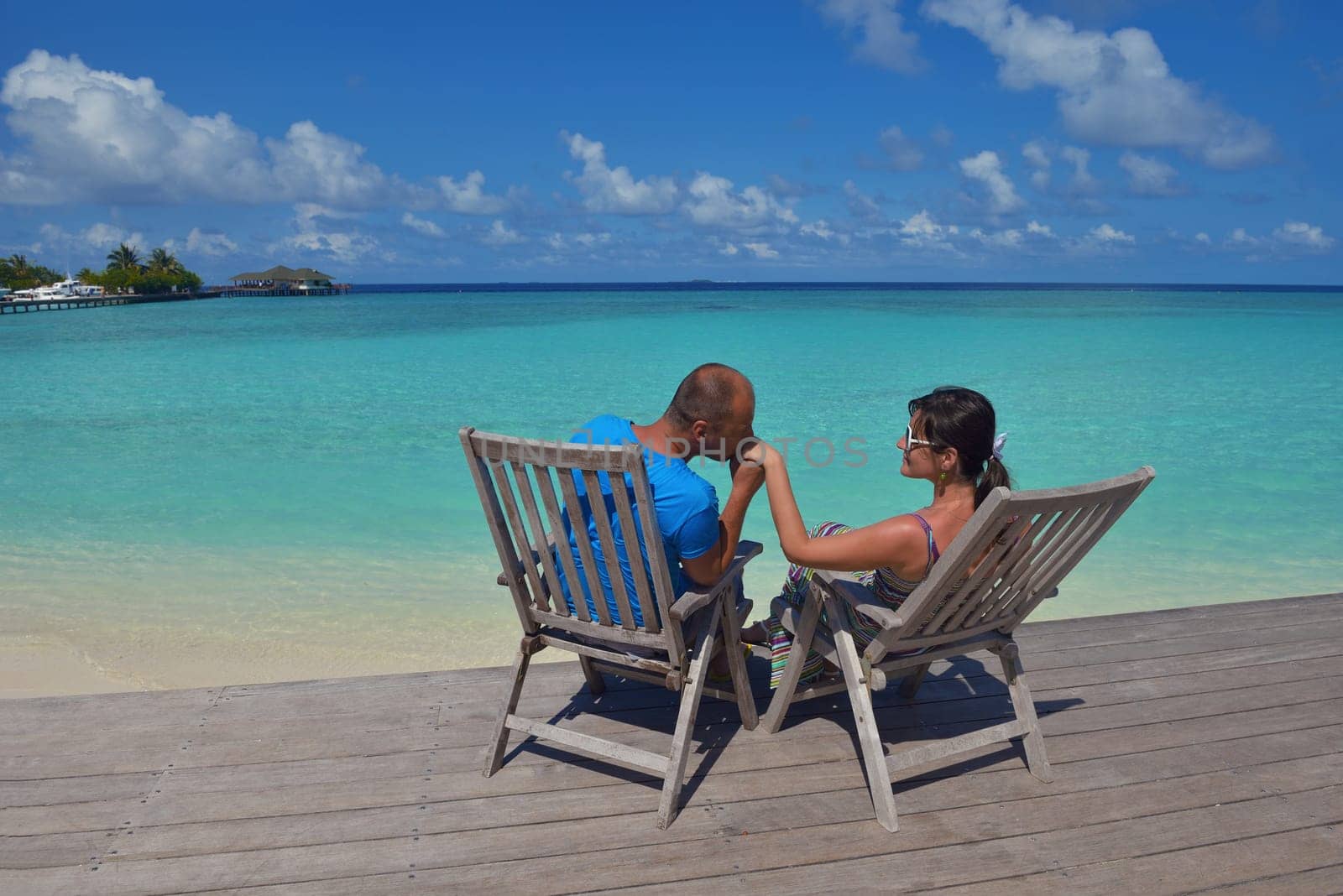 happy young  couple at summer vacation have fun and relax at beautiful sunny  day on beach