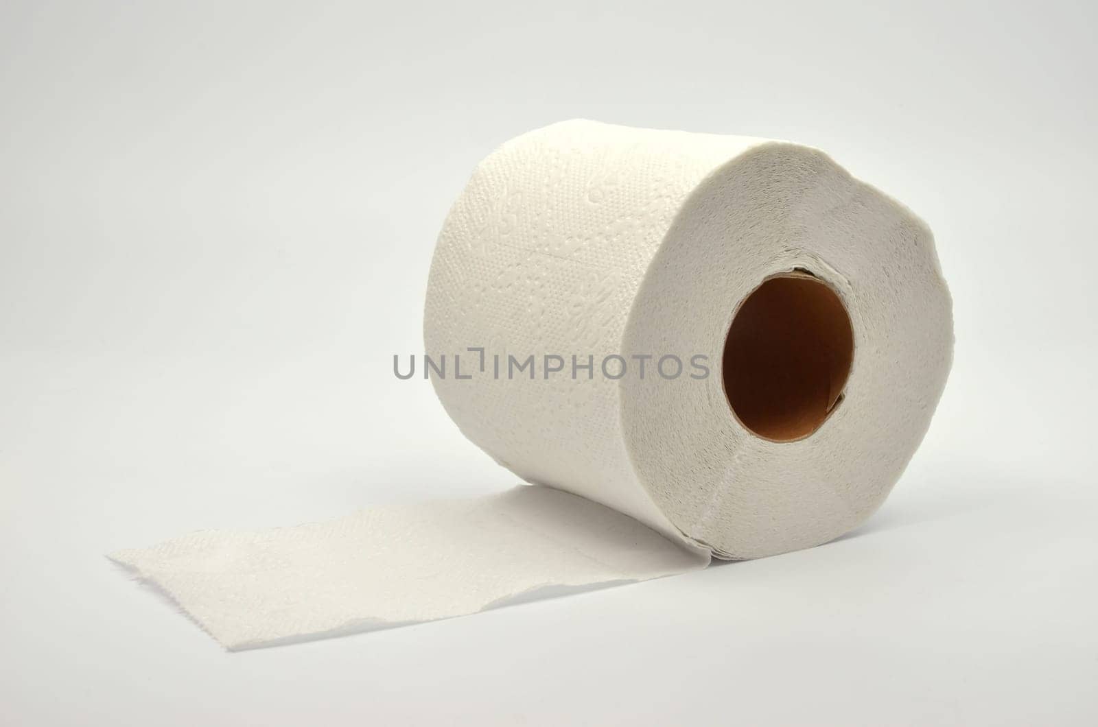 Simple toilet paper on gray background