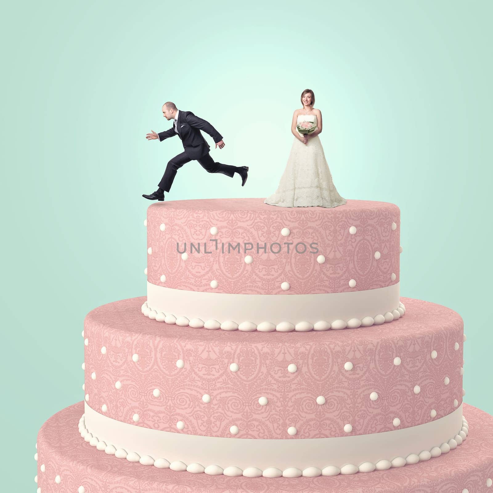 funny wedding cake with goom and bride