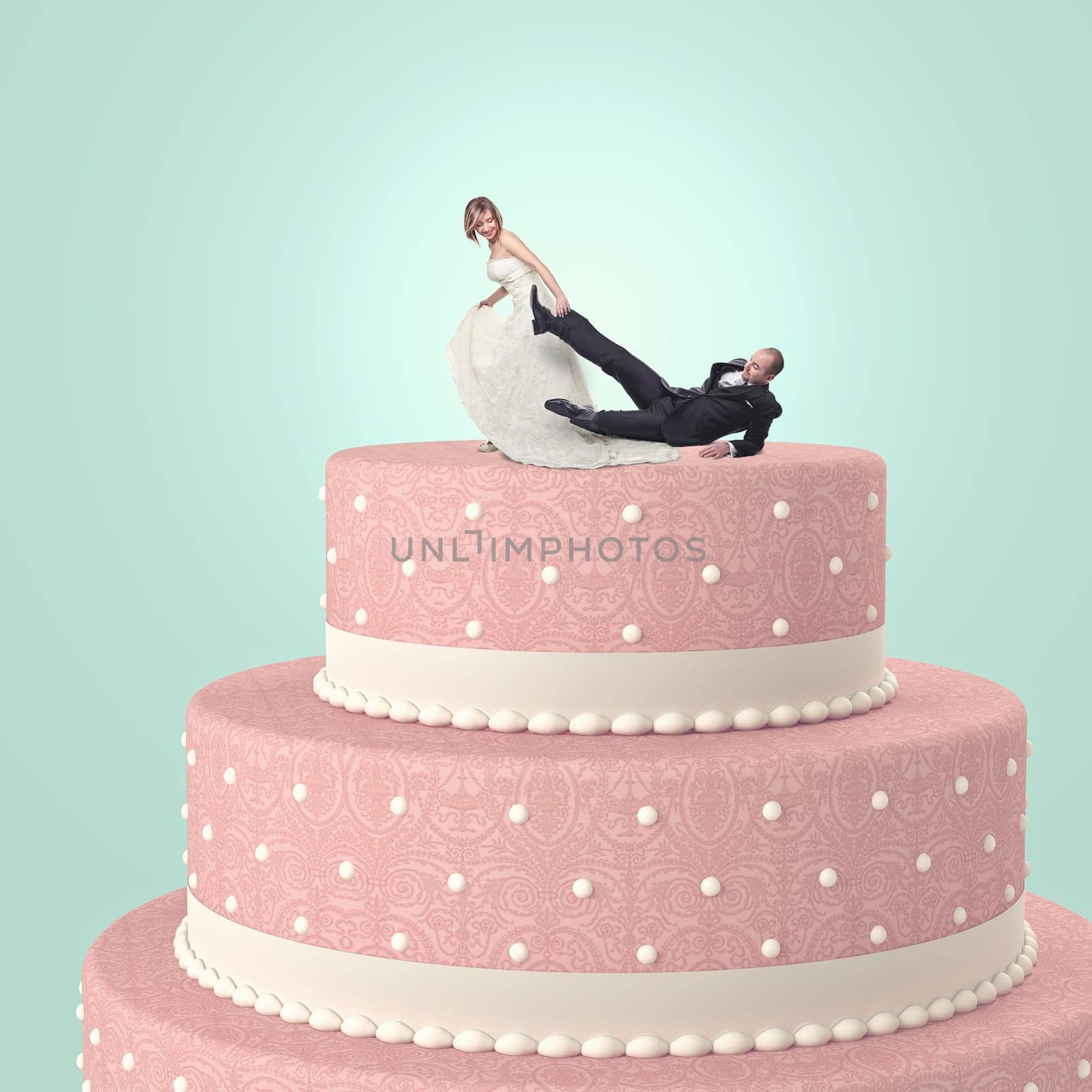 funny wedding cake with goom and bride