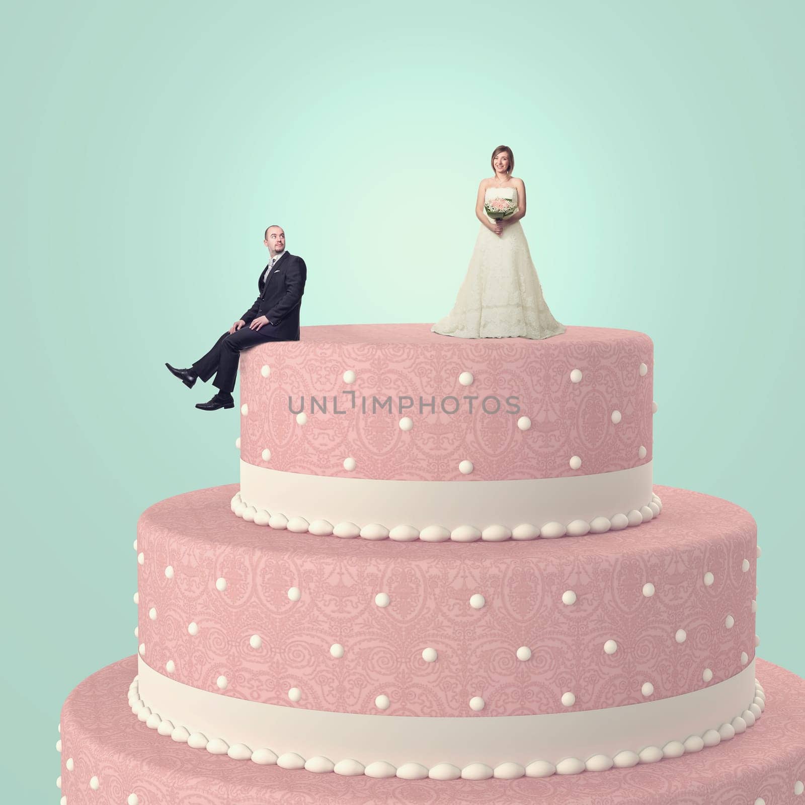funny wedding cake with goom and bride