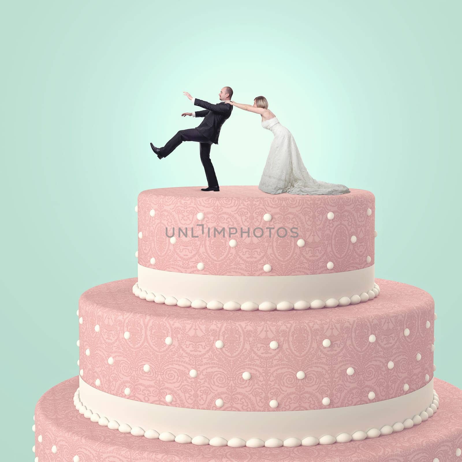 funny wedding cake with goom and bride