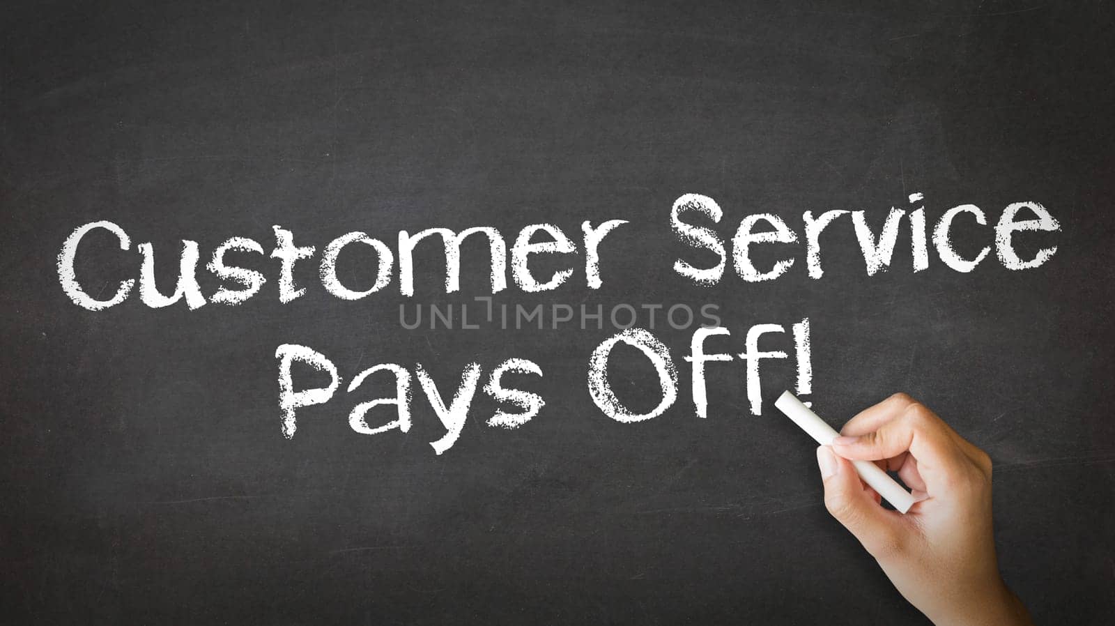 A person drawing and pointing at a Customer service pays off Chalk Illustration