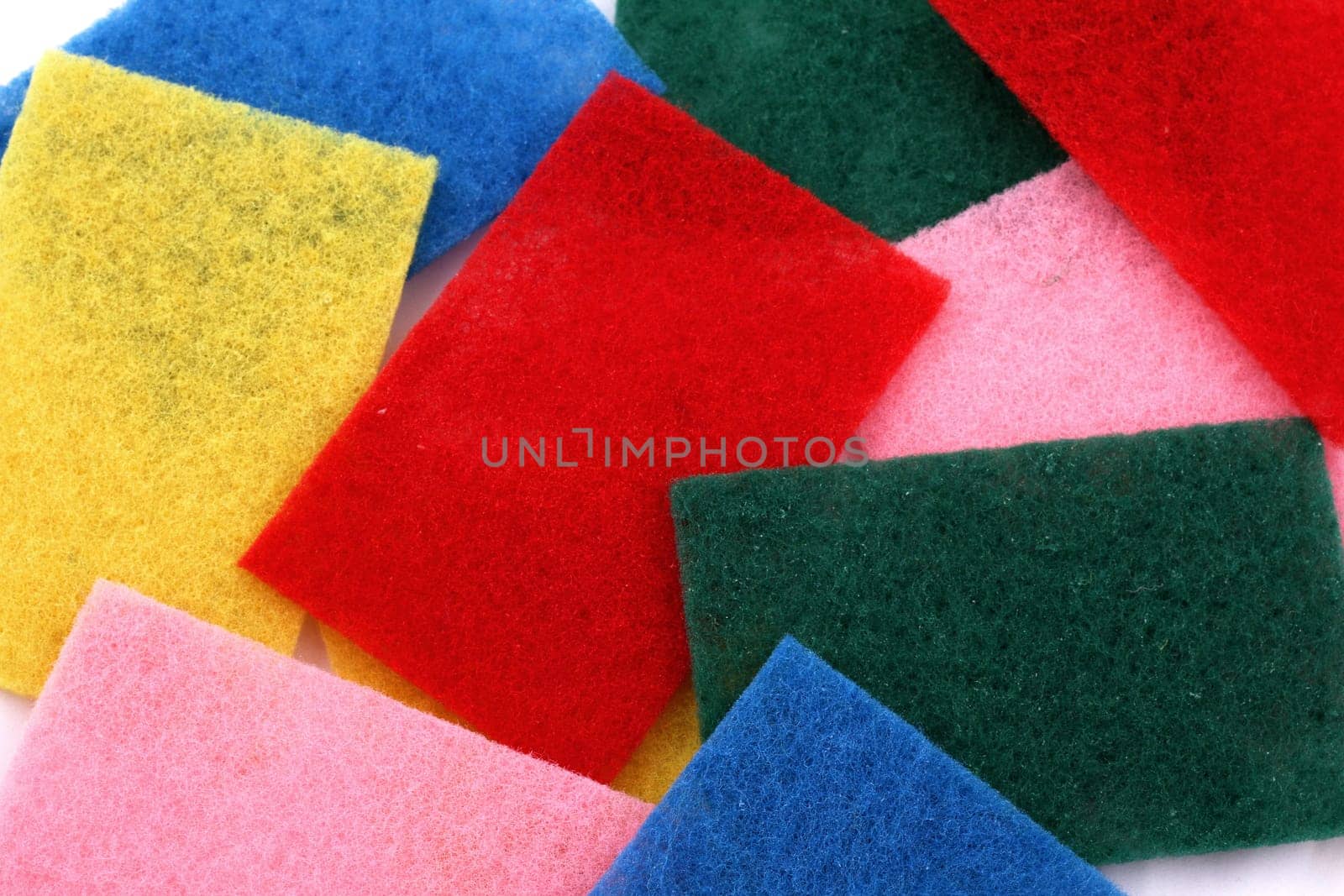 A lot of sponges in different colors background.
