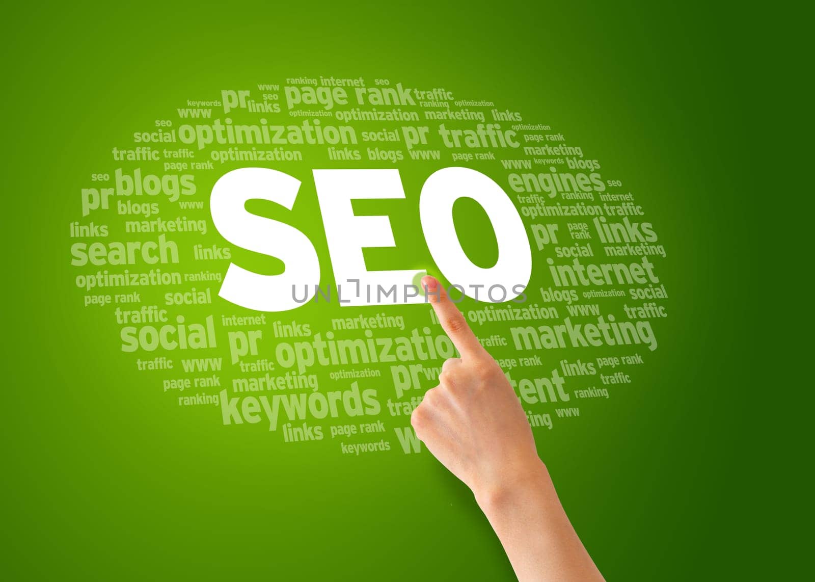Hand pointing at a Search Engine Optimization Word Cloud.