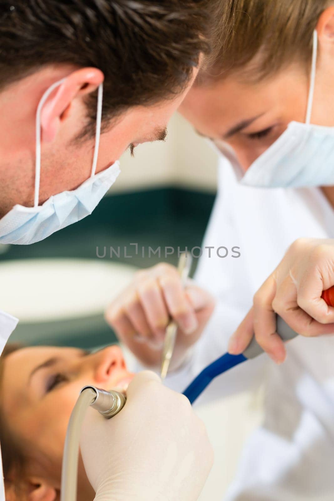 Patient at dentist - treatment with drilling