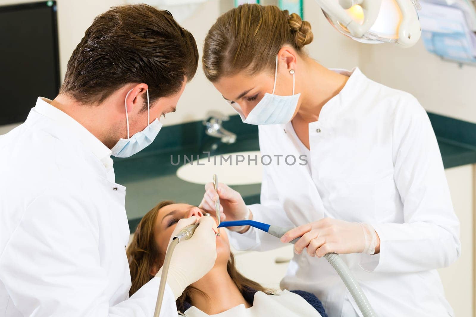 Patient at dentist - treatment with drilling