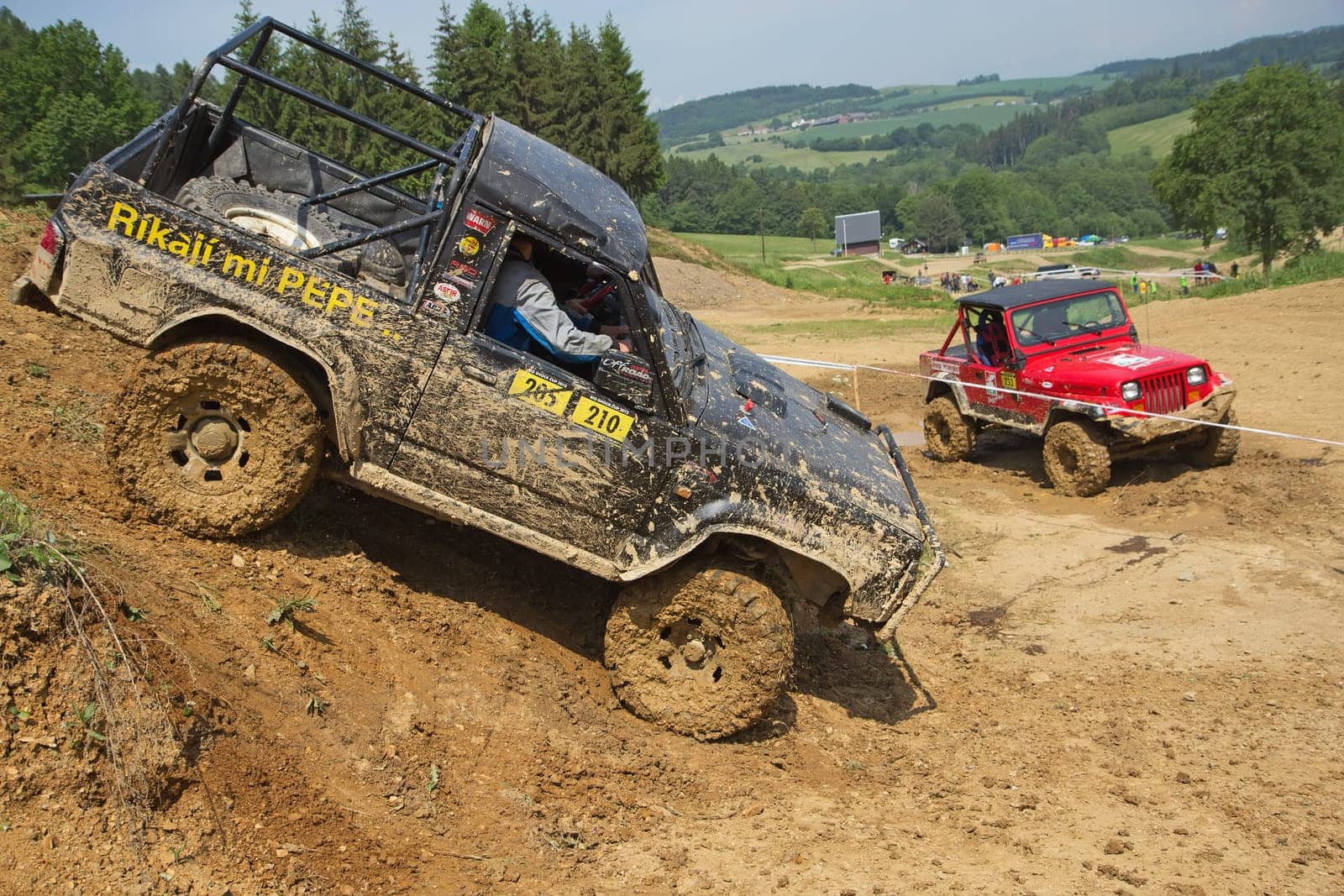 MOHELNICE, CZECH REPUBLIC - JUNE 09. Off-road cars on a trial race in the "BIG SHOCK CUP Trial 2013"" on June 09, 2013  in the town of Mohelnice, Czech Republic."