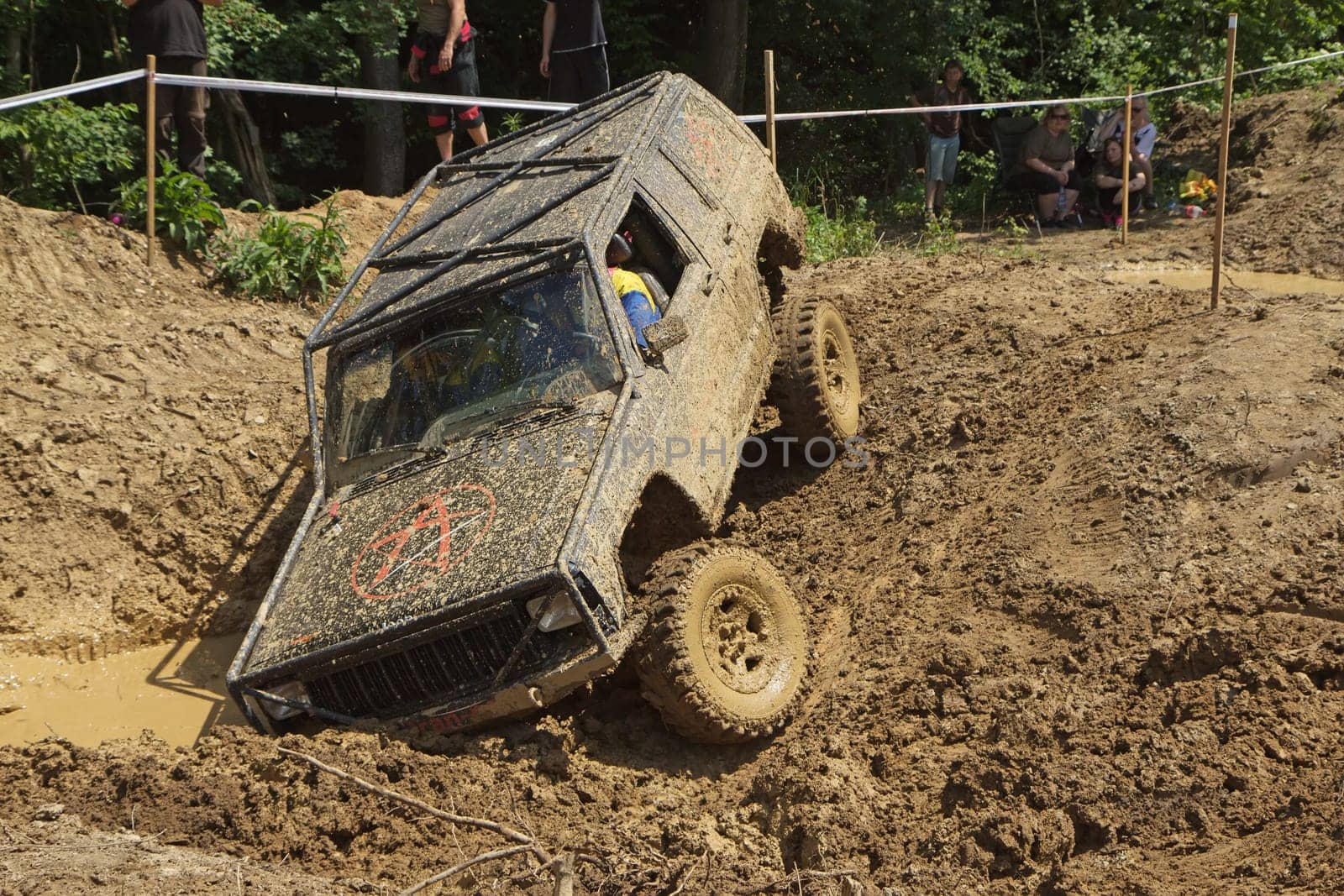 MOHELNICE, CZECH REPUBLIC - JUNE 09. Off road car stuck in a muddy terrain in the "BIG SHOCK CUP Trial 2013"" on June 09, 2013  in the town of Mohelnice, Czech Republic."
