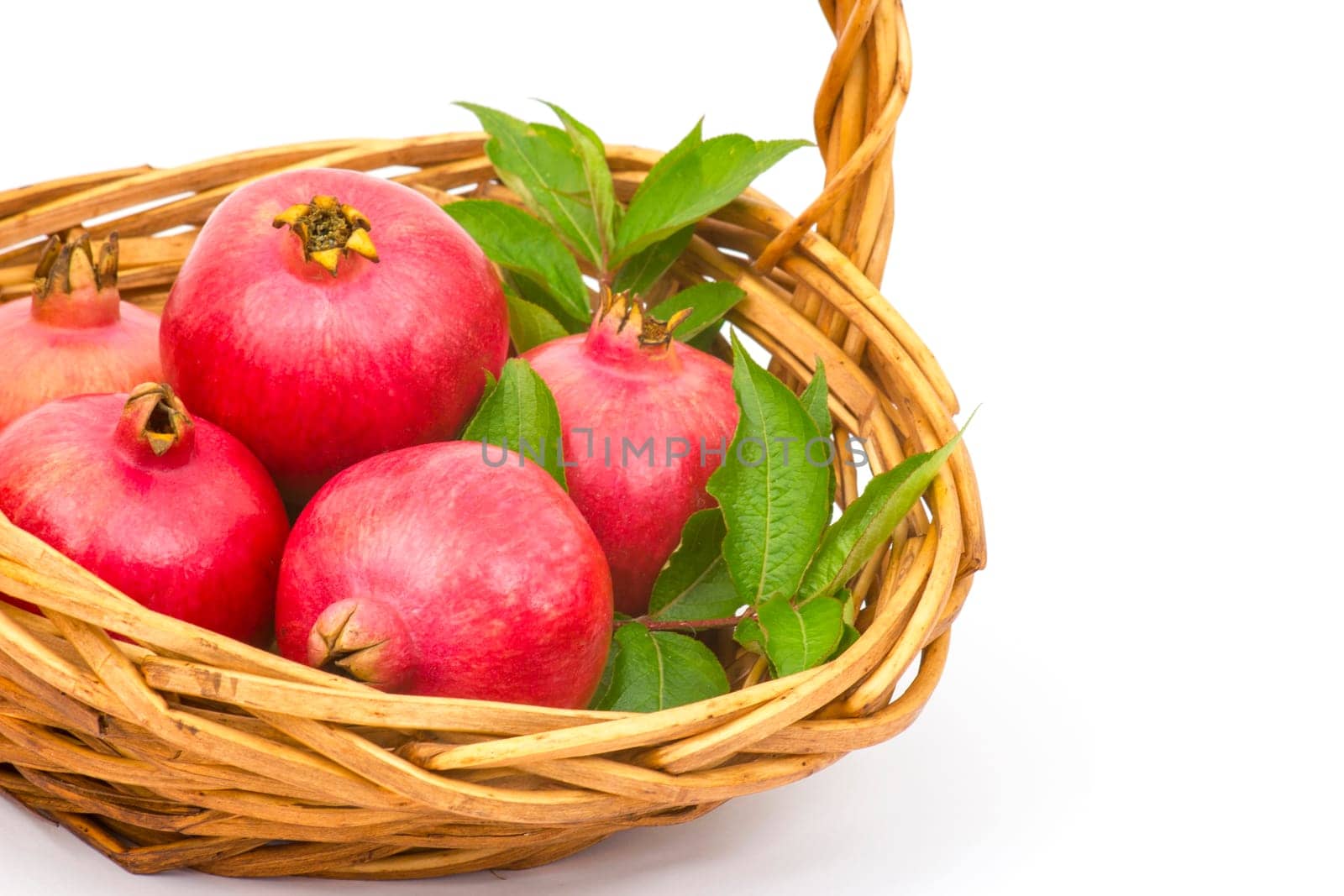 fresh pomegranates in a basket