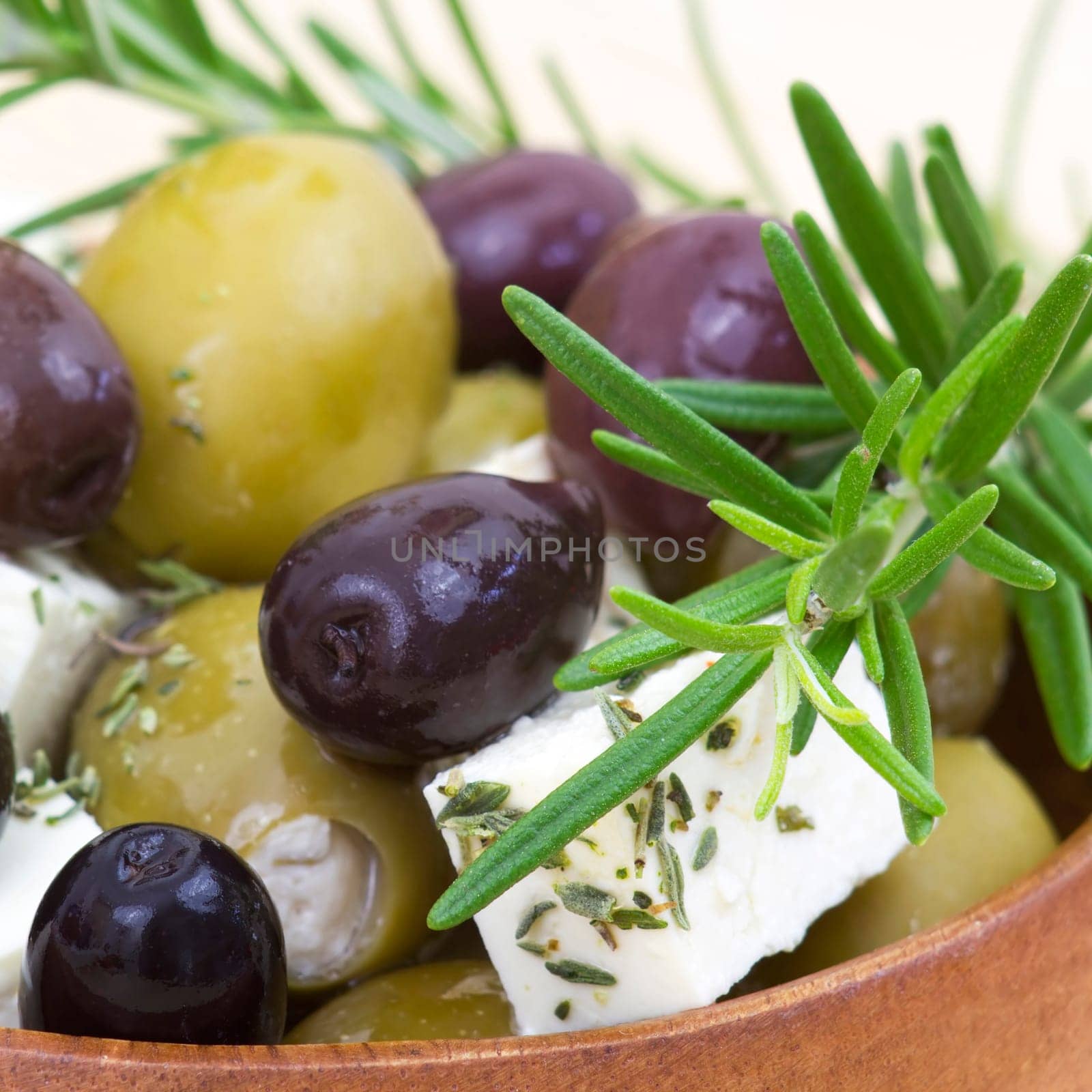 feta cheese and olives with herbs in olive oil