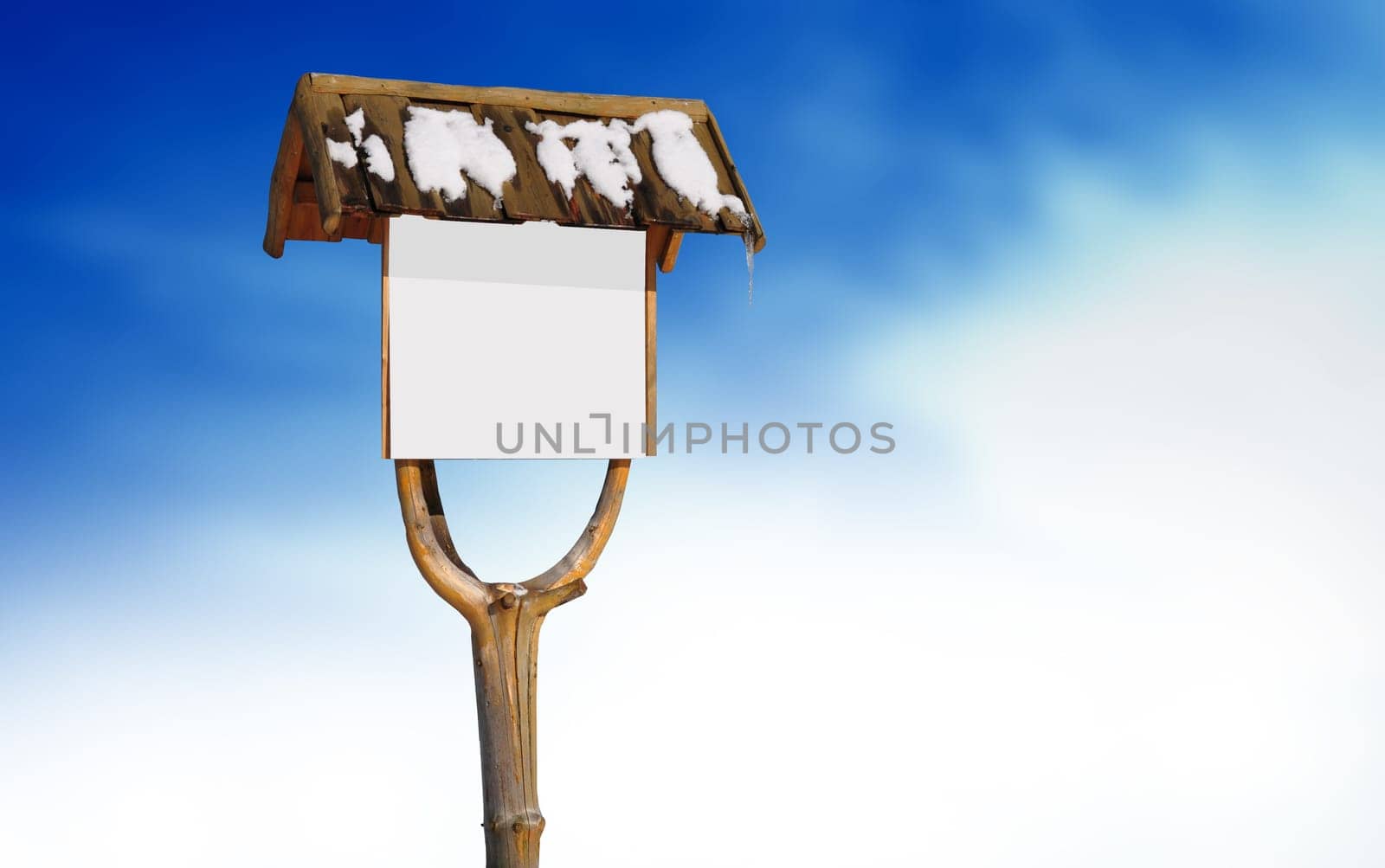 Wooden road sign with snow on cloud background.