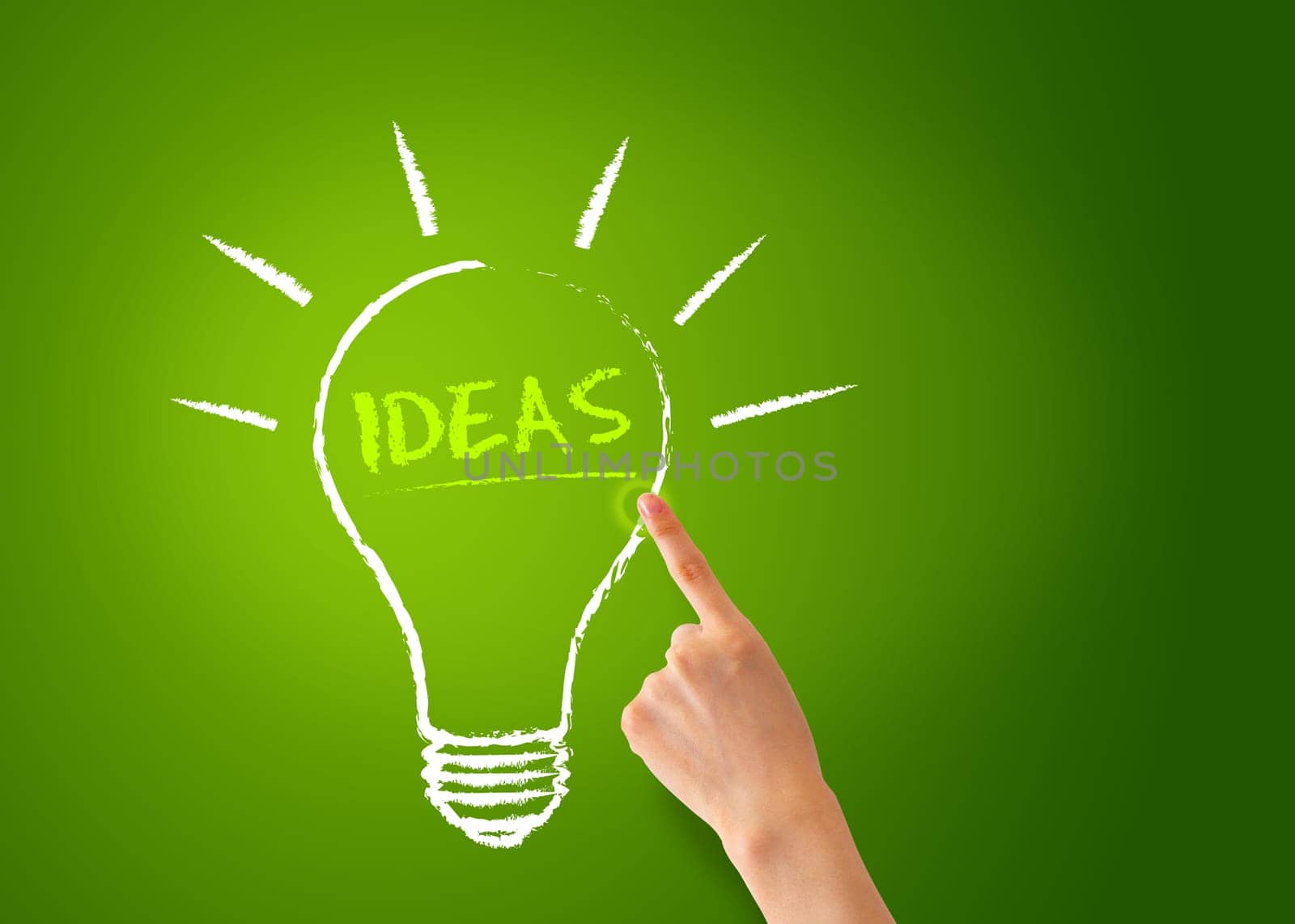 A Hand pointing of a Ideas Lightbulb on green background.