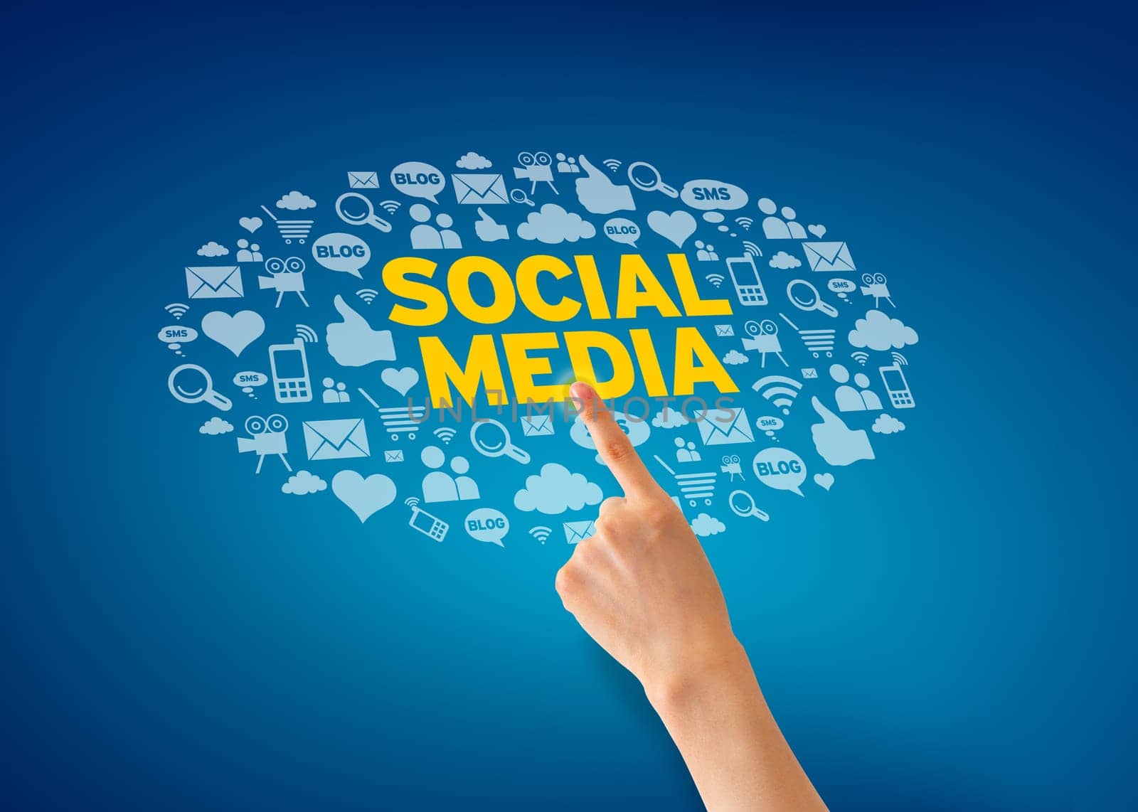 Hand pointing at a Social Media Icon cloud on blue background.