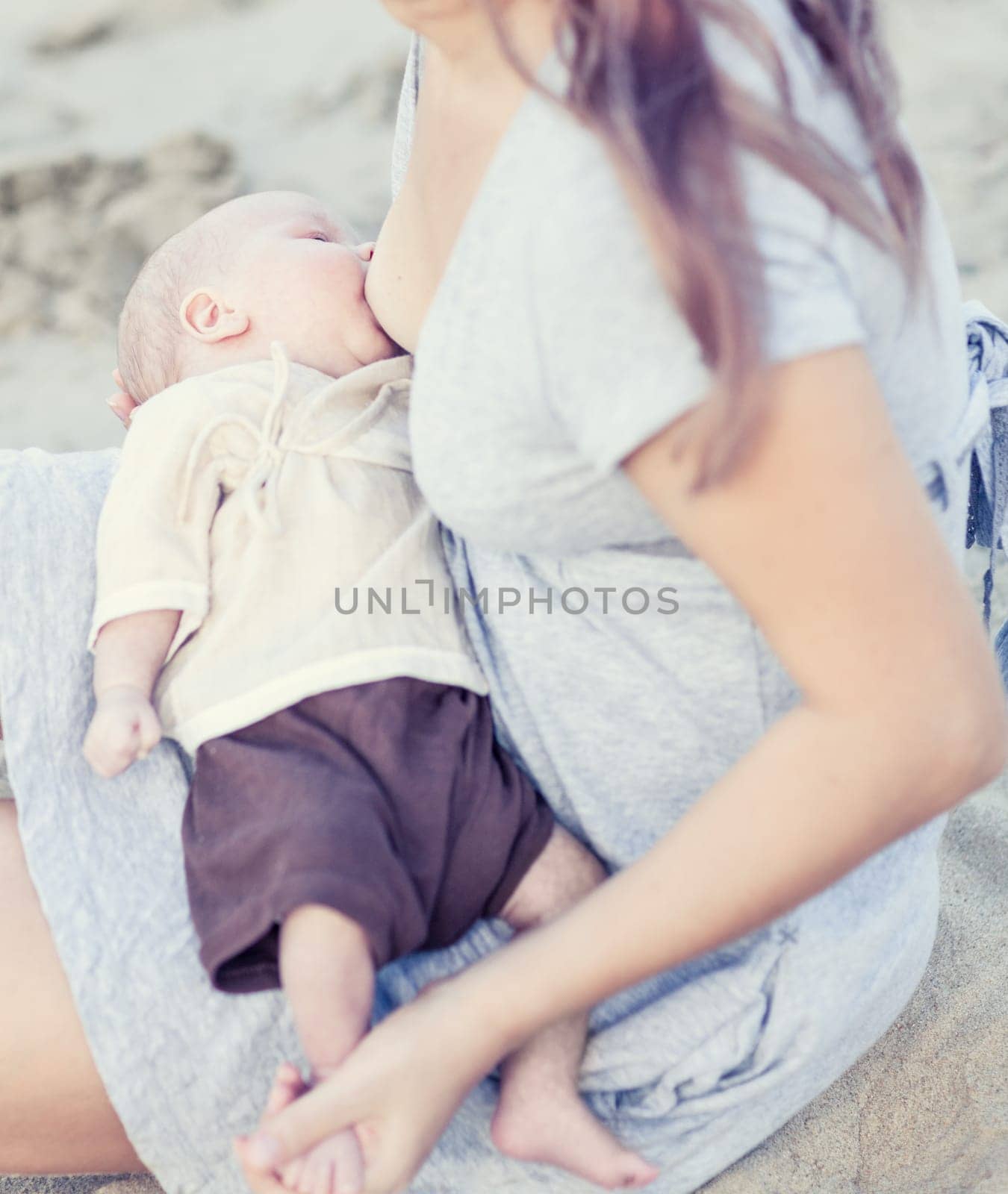Mother breastfeeding a baby outdoor