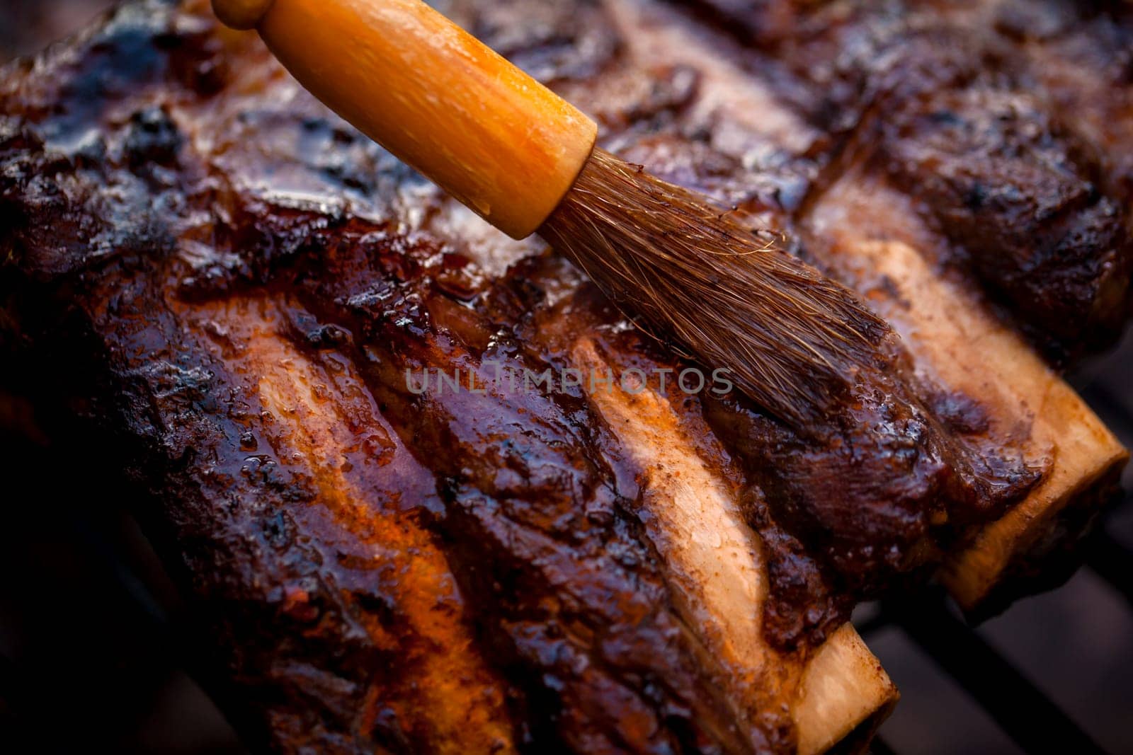 Beef ribs being roasted on the BBQ.