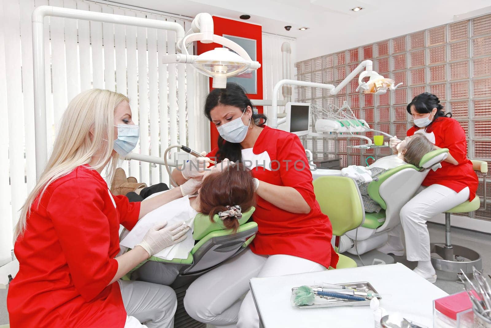 Female dentists at work in modern dental office