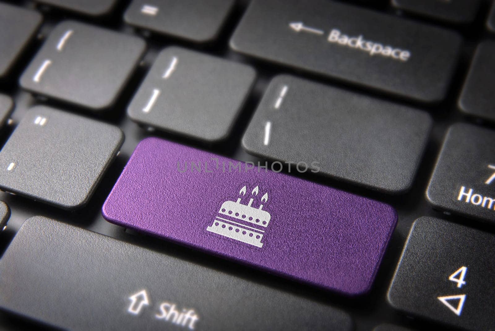Entertainment key with Birthday cake icon on laptop keyboard. Included clipping path, so you can easily edit it.